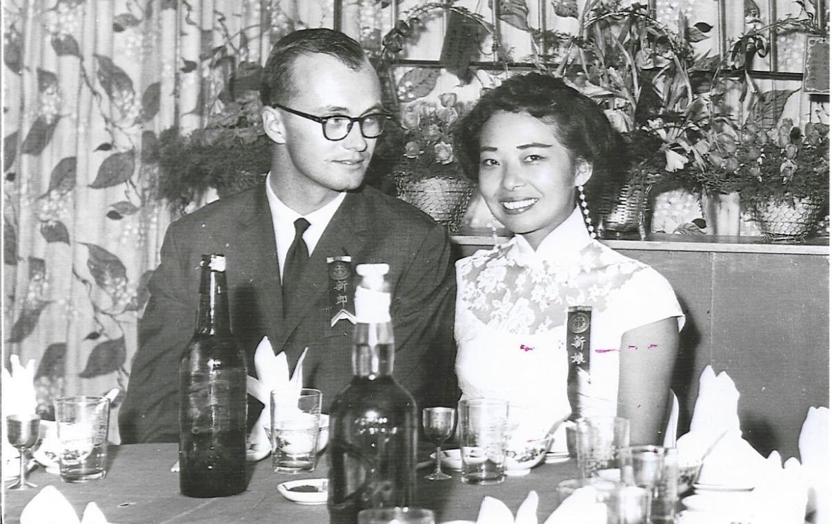 A man and woman sitting at a table