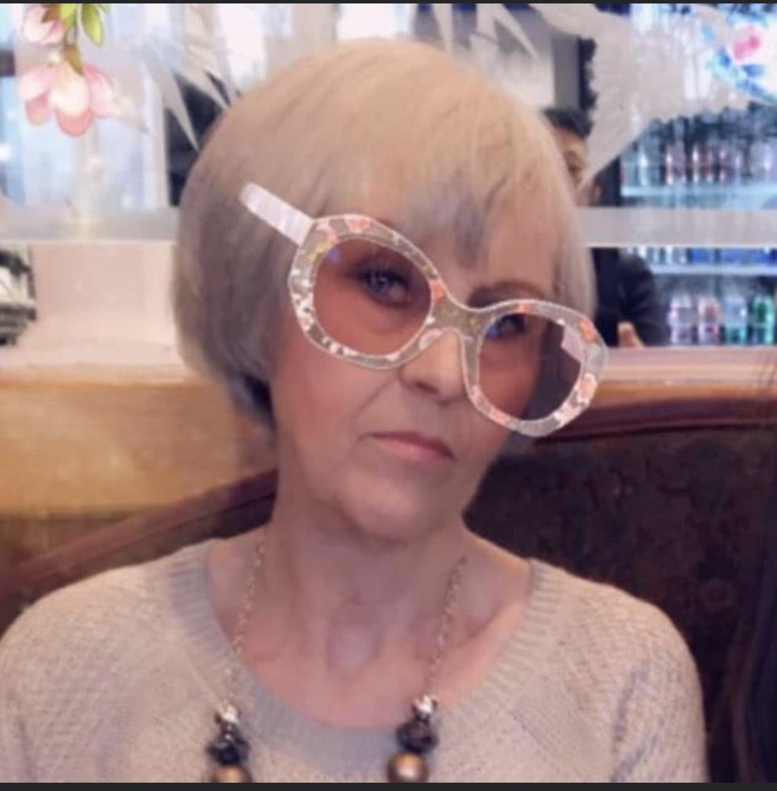 A woman wearing sunglasses