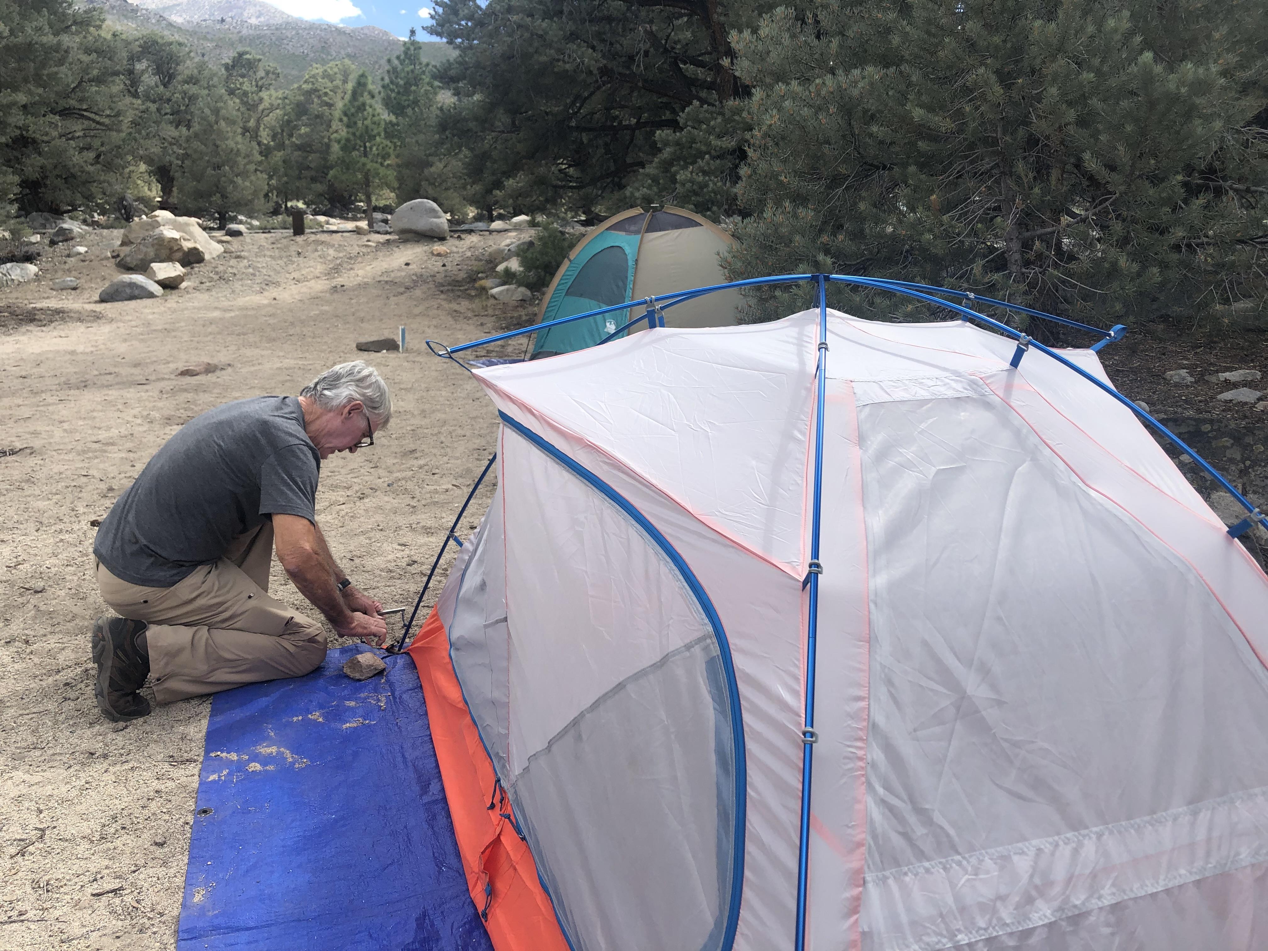A man setting up a tent