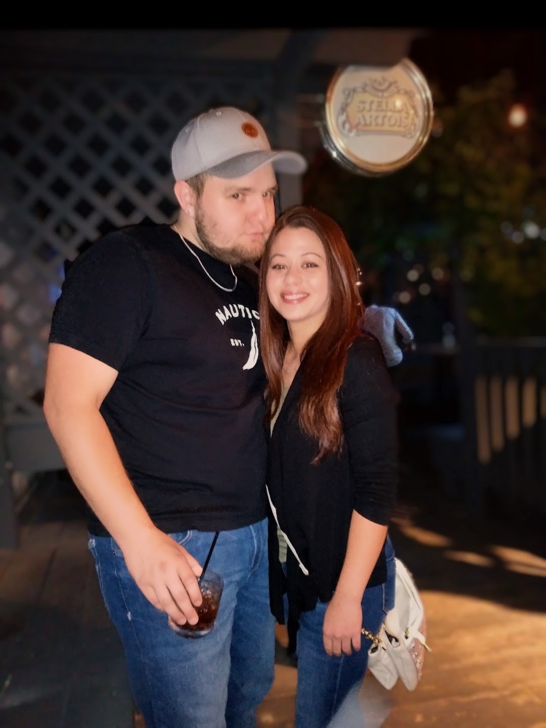 A man and woman posing for a picture