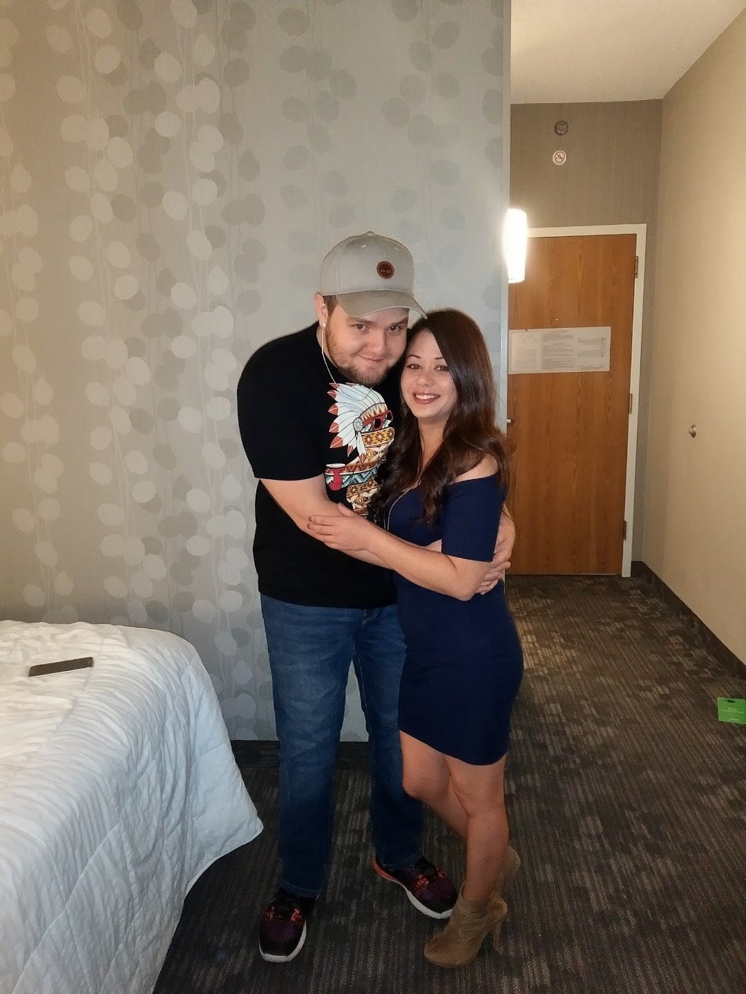 A man and woman posing for a picture
