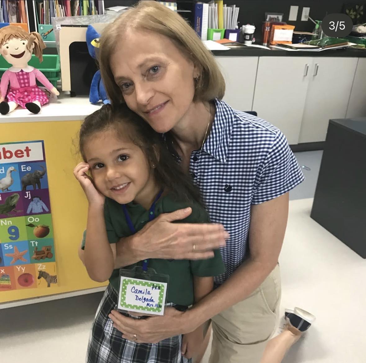 A woman holding a girl
