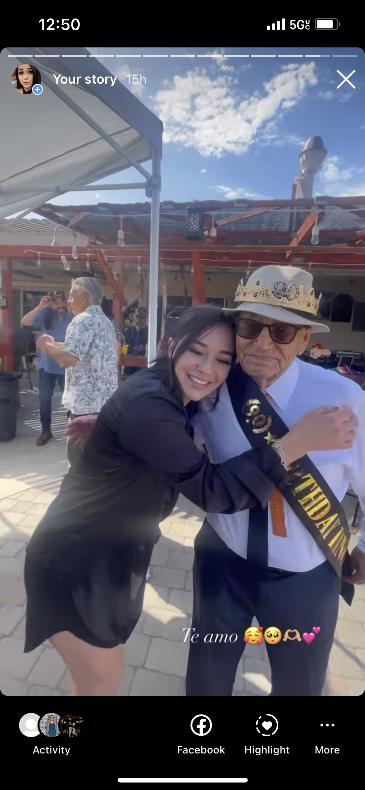 A woman hugging an old man
