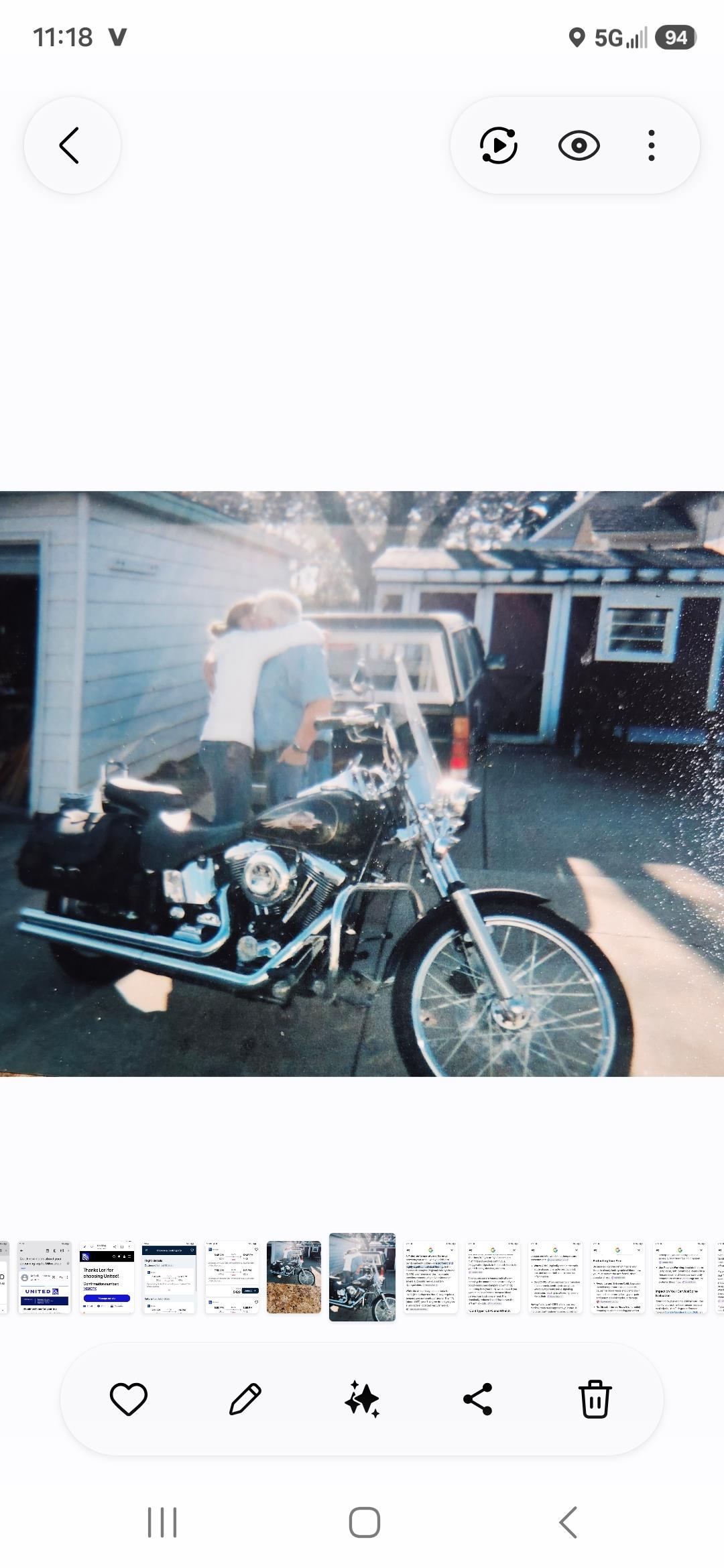 A couple hugging on a motorcycle