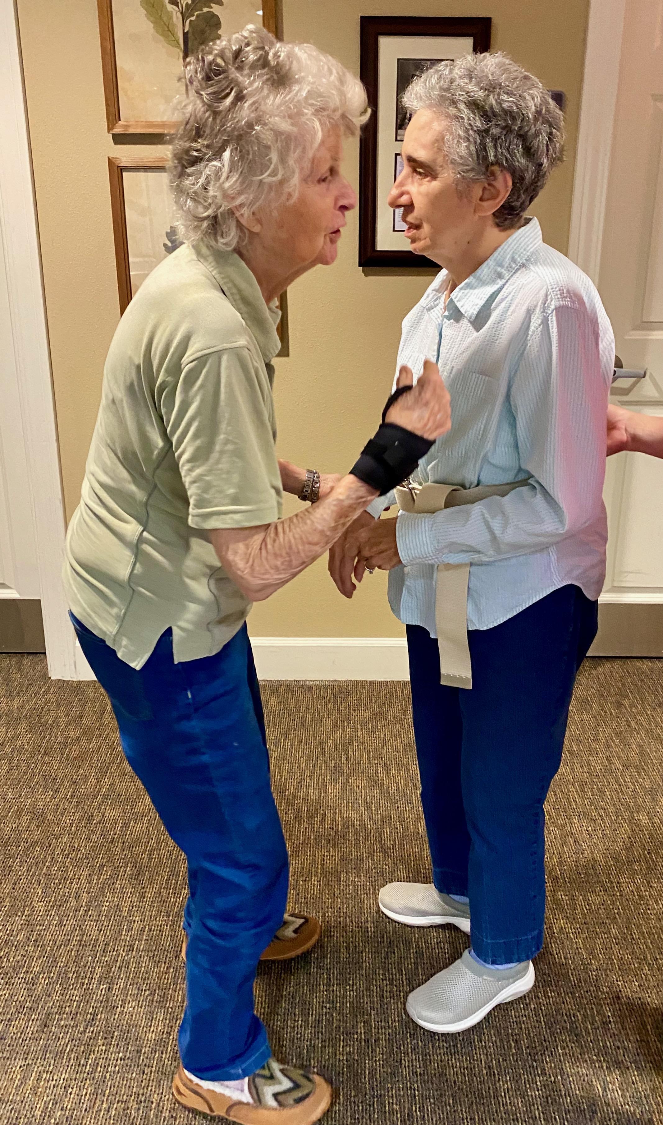 Two women standing in a room