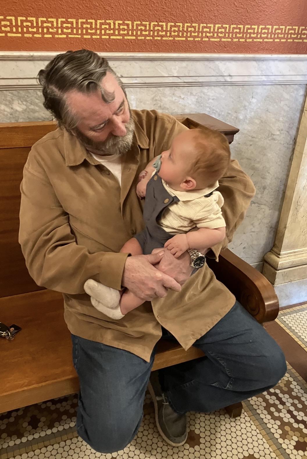A man holding a baby