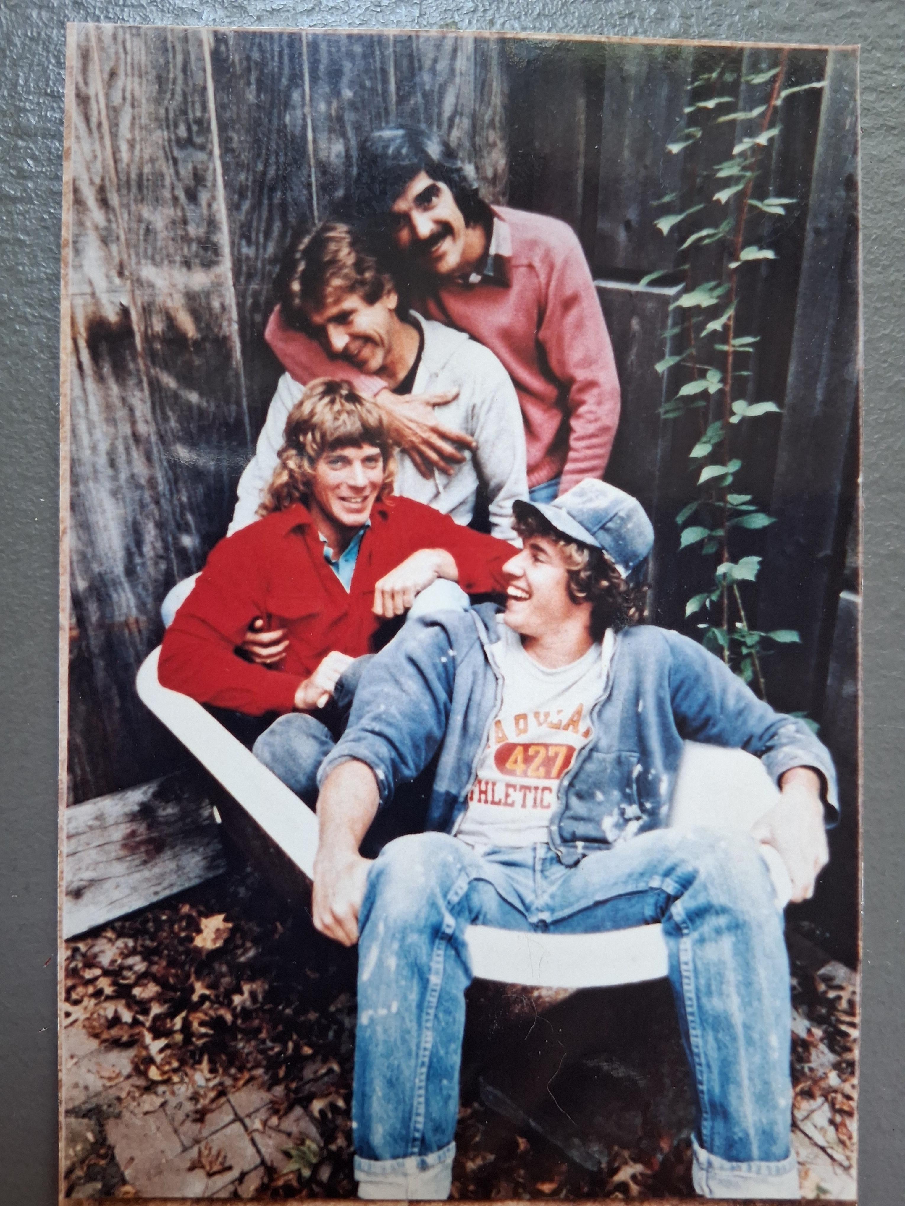 A group of men sitting in a bathtub