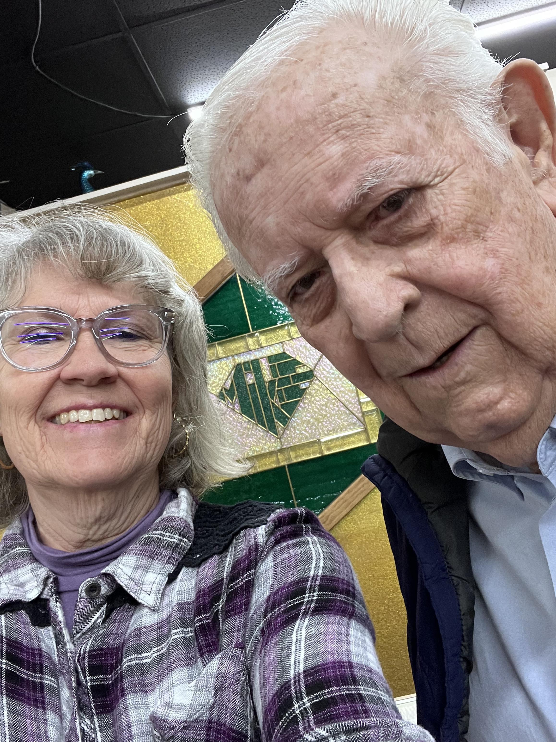 A man and woman taking a selfie