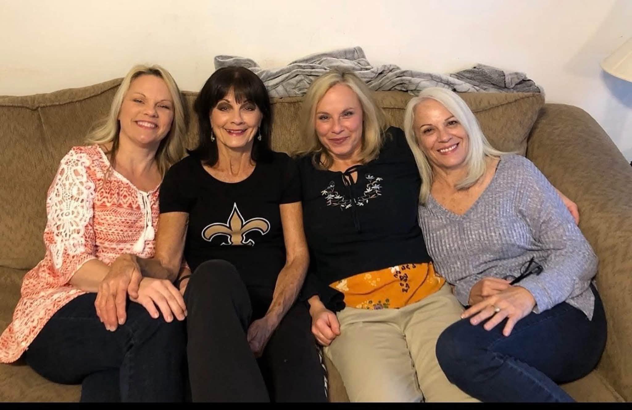 A group of women sitting on a couch