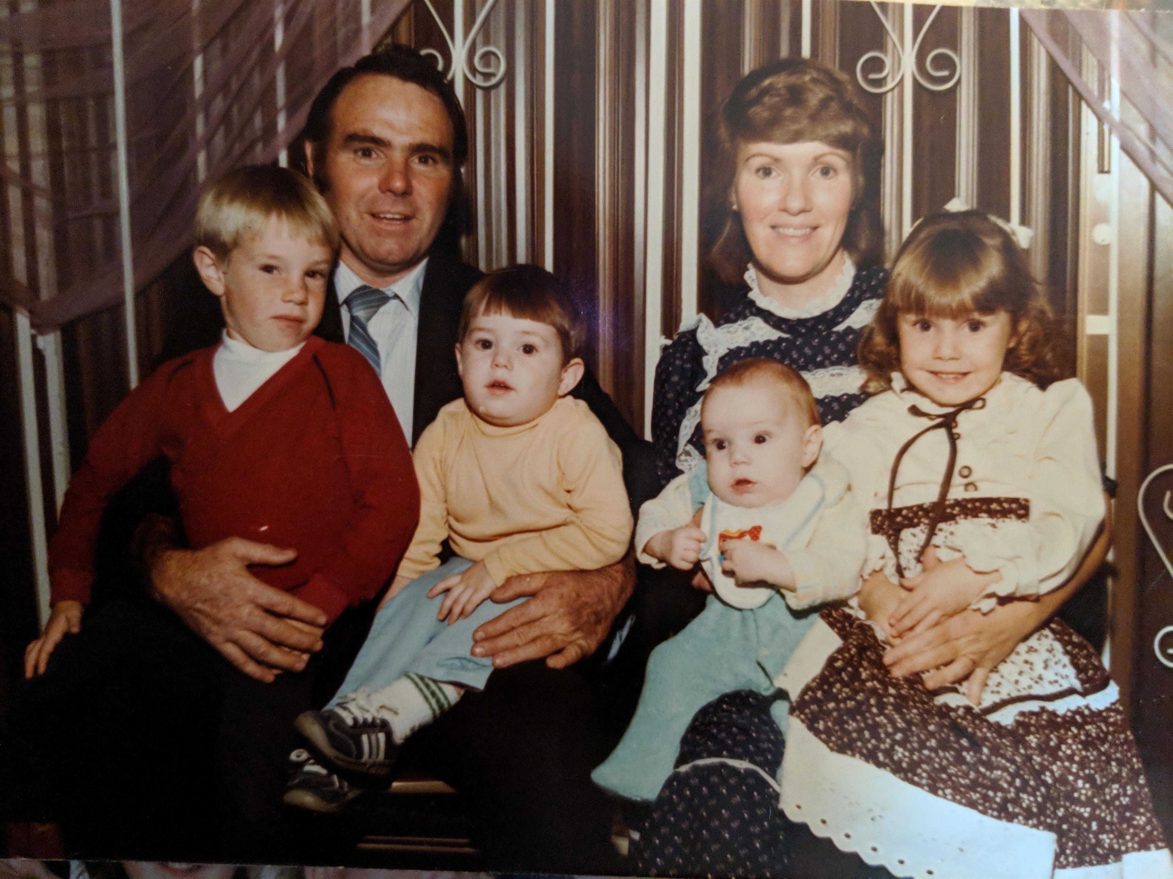 A man and woman with children