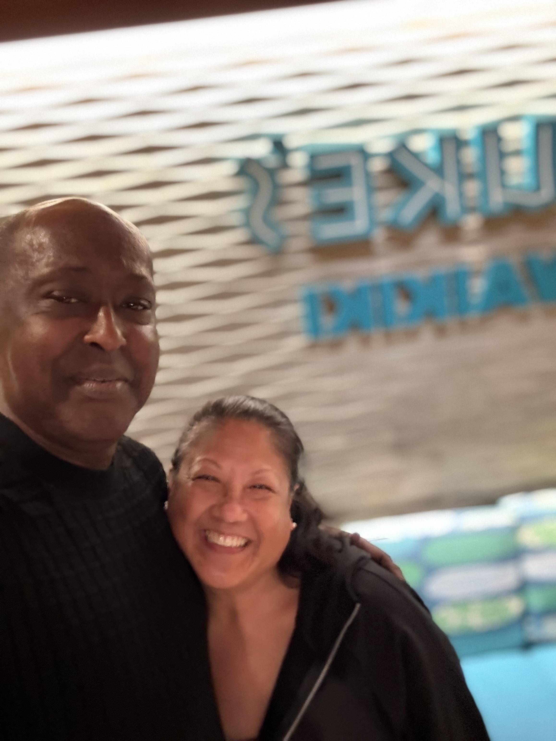 A man and woman posing for a picture