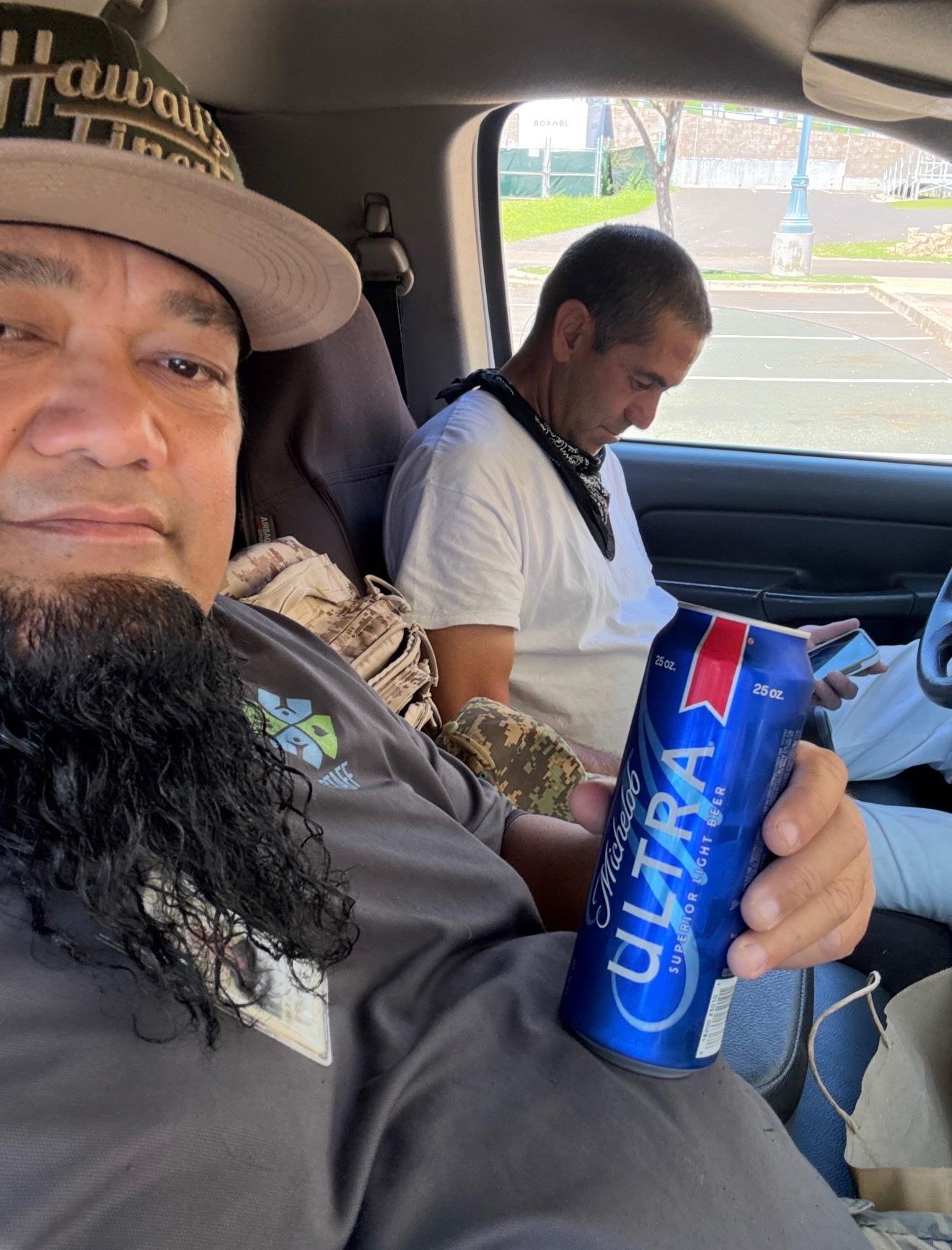 A man holding a can of beer