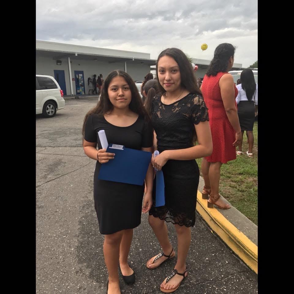 Two women standing next to each other