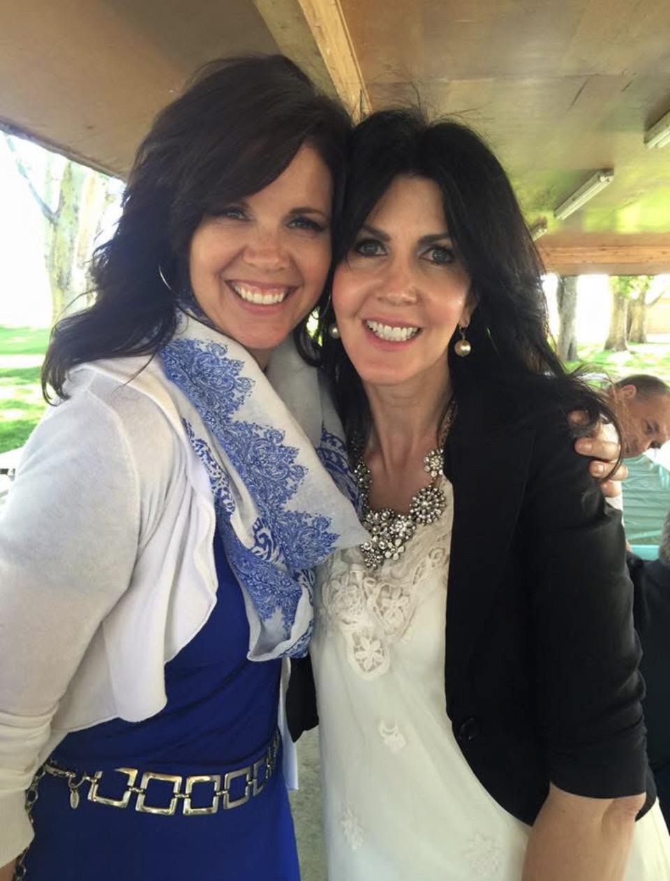Two women smiling at the camera