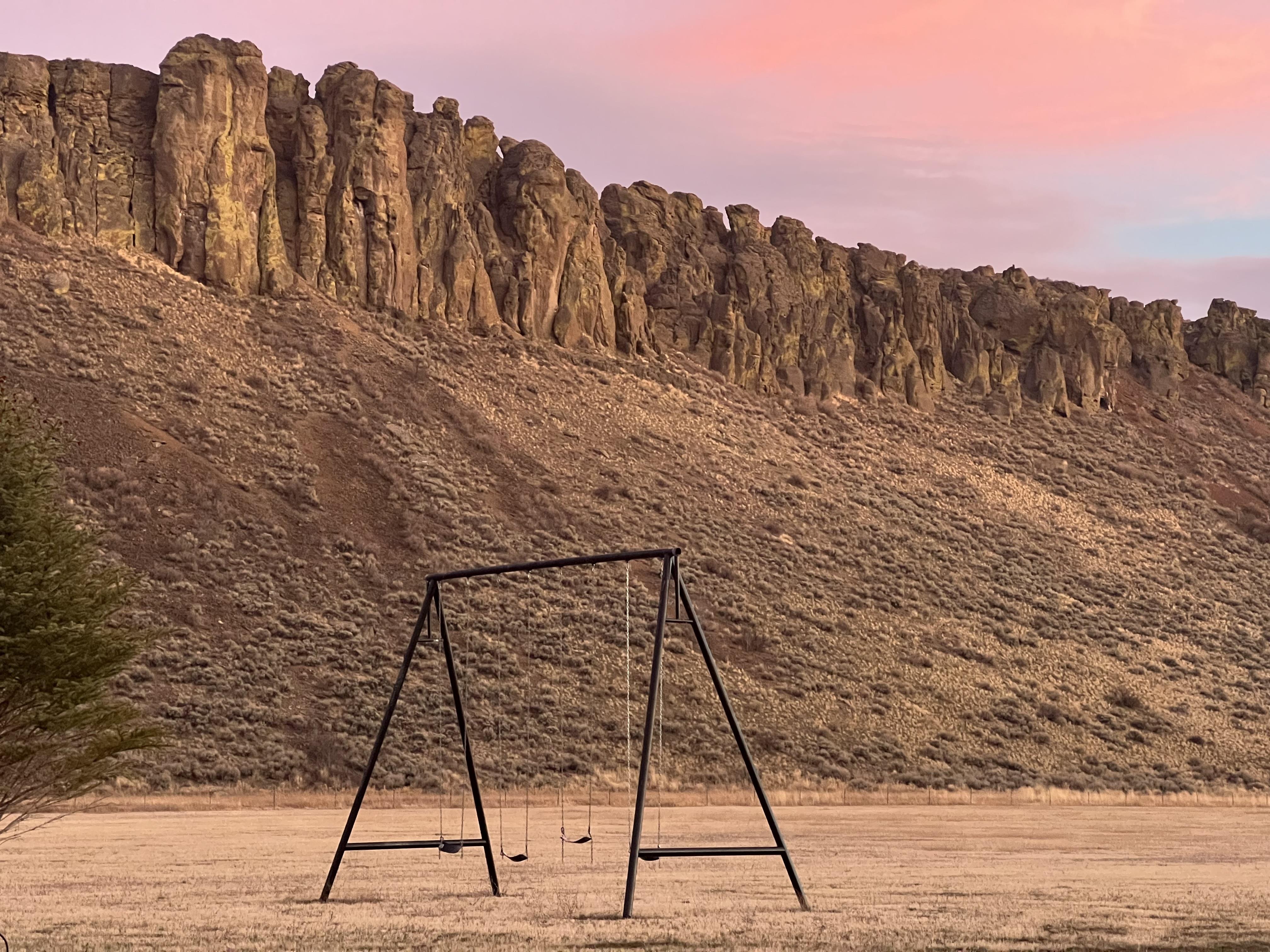 A swing set in a field