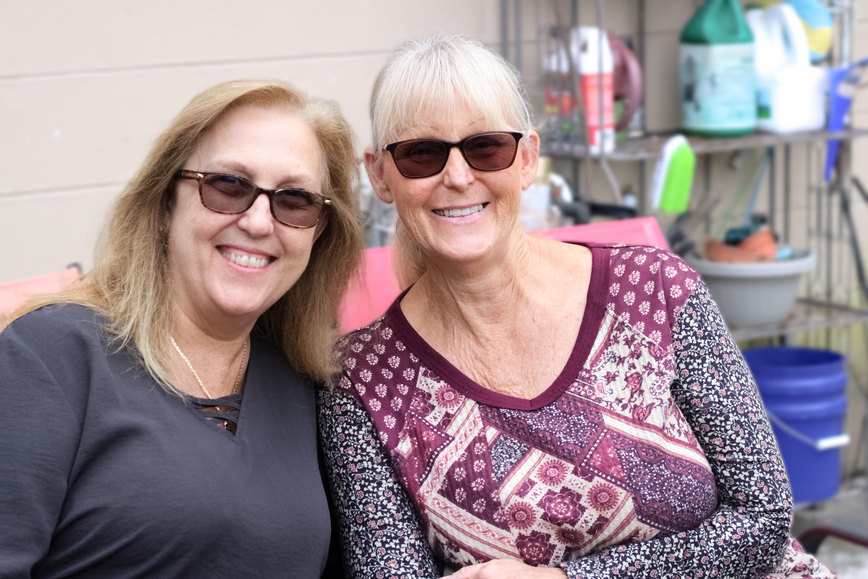 Two women wearing sunglasses