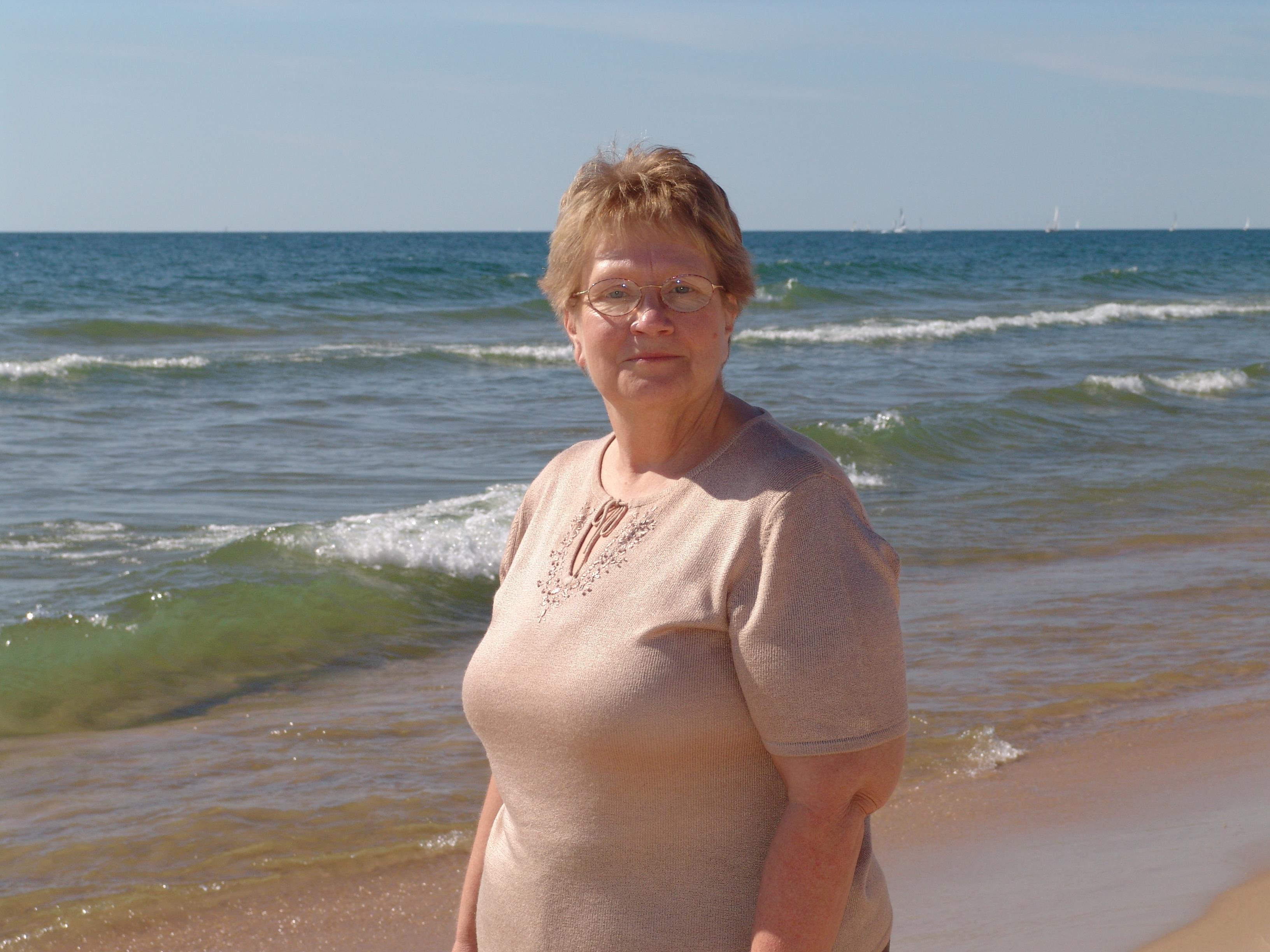 A woman standing on a beach