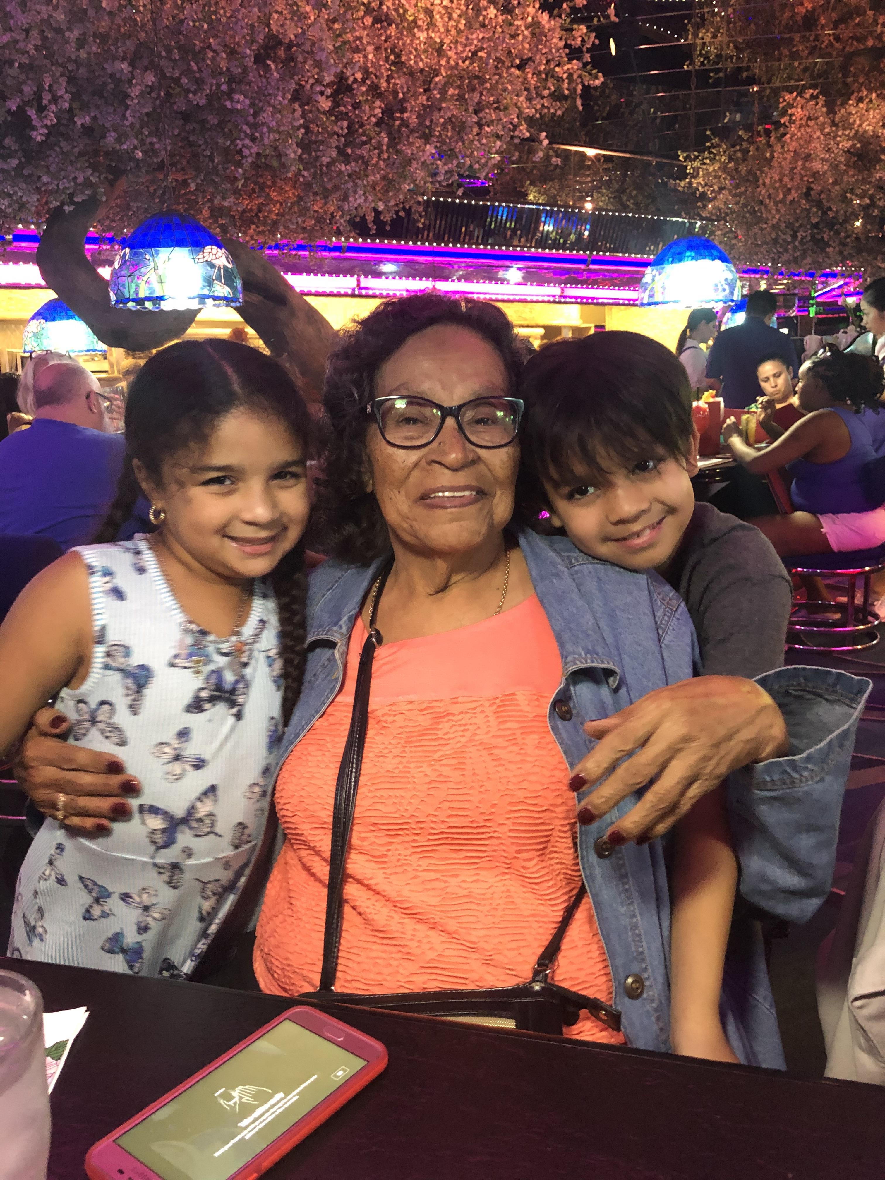 A woman and two children posing for a picture
