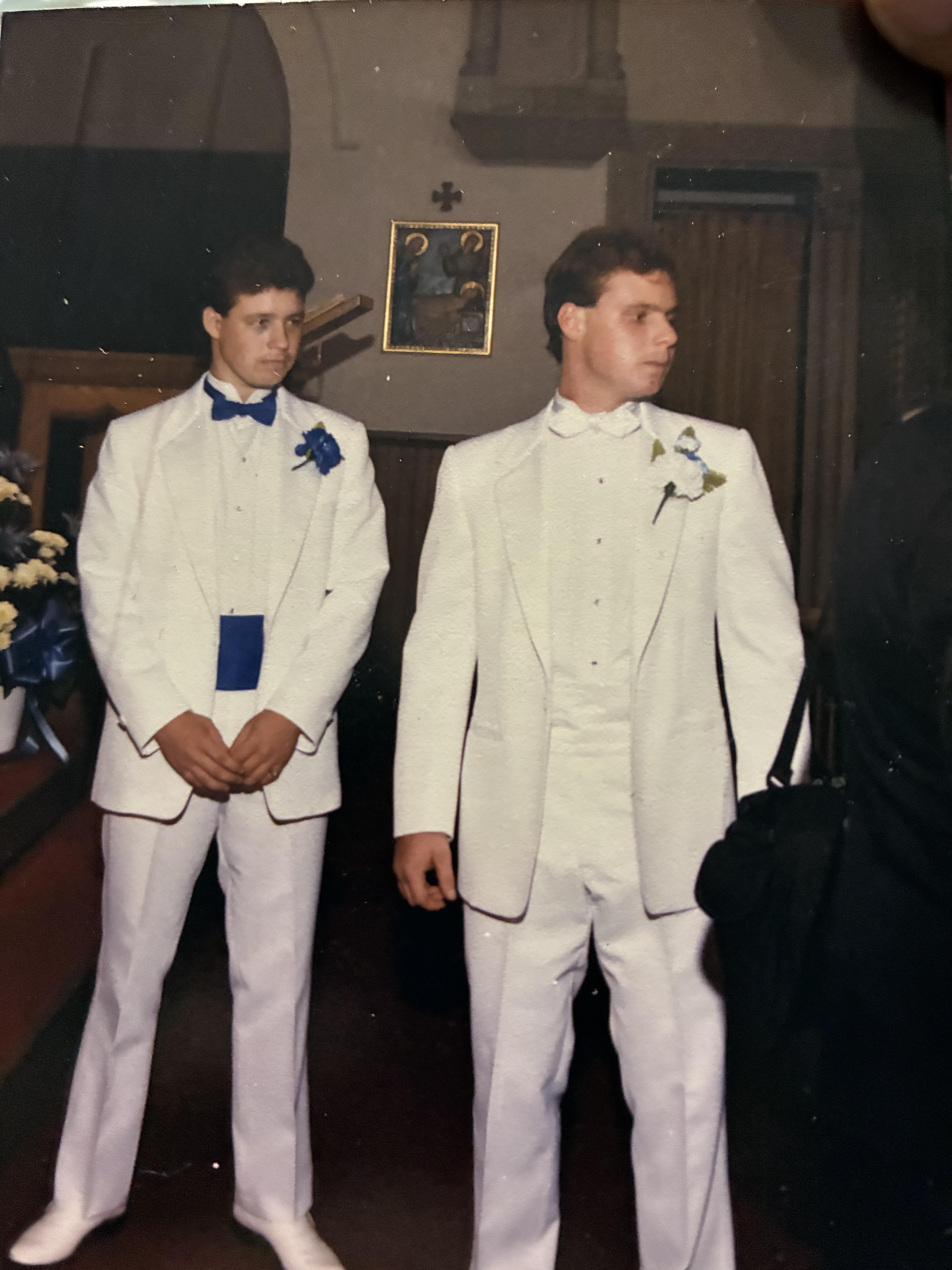 Two men in white suits