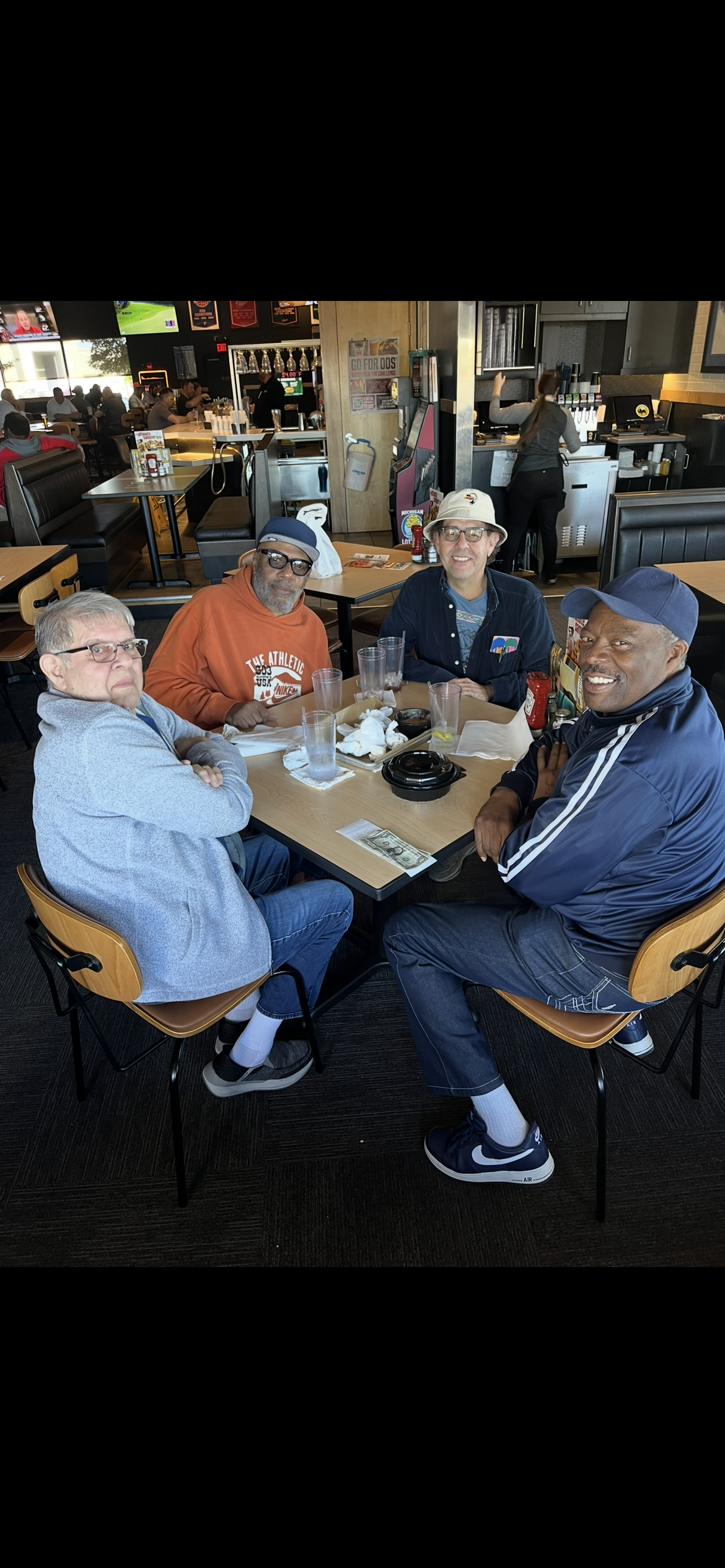 A group of men sitting at a table