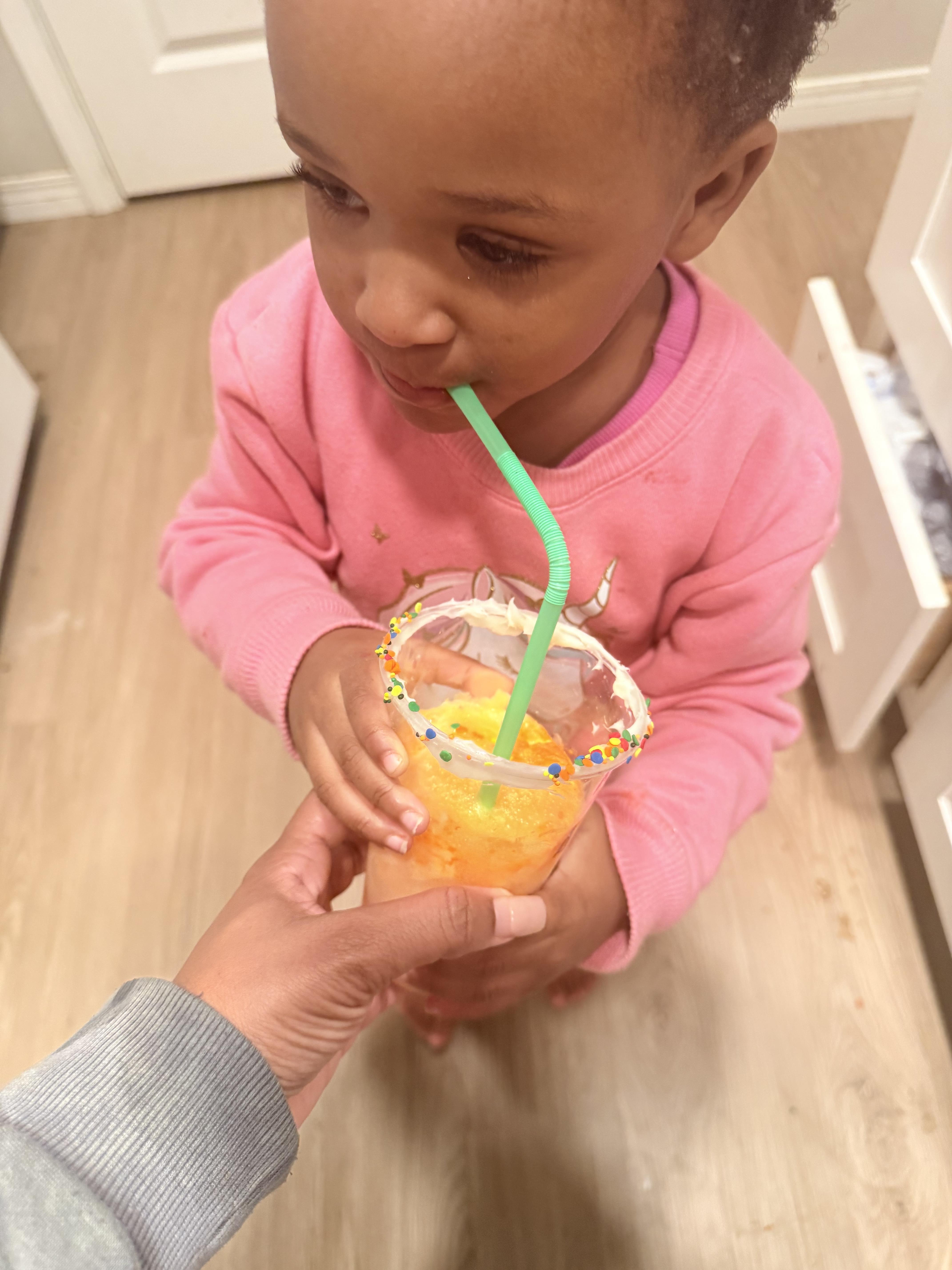 A child drinking from a straw