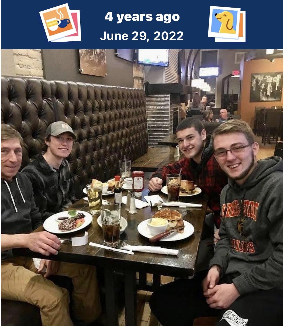 A group of men sitting at a table