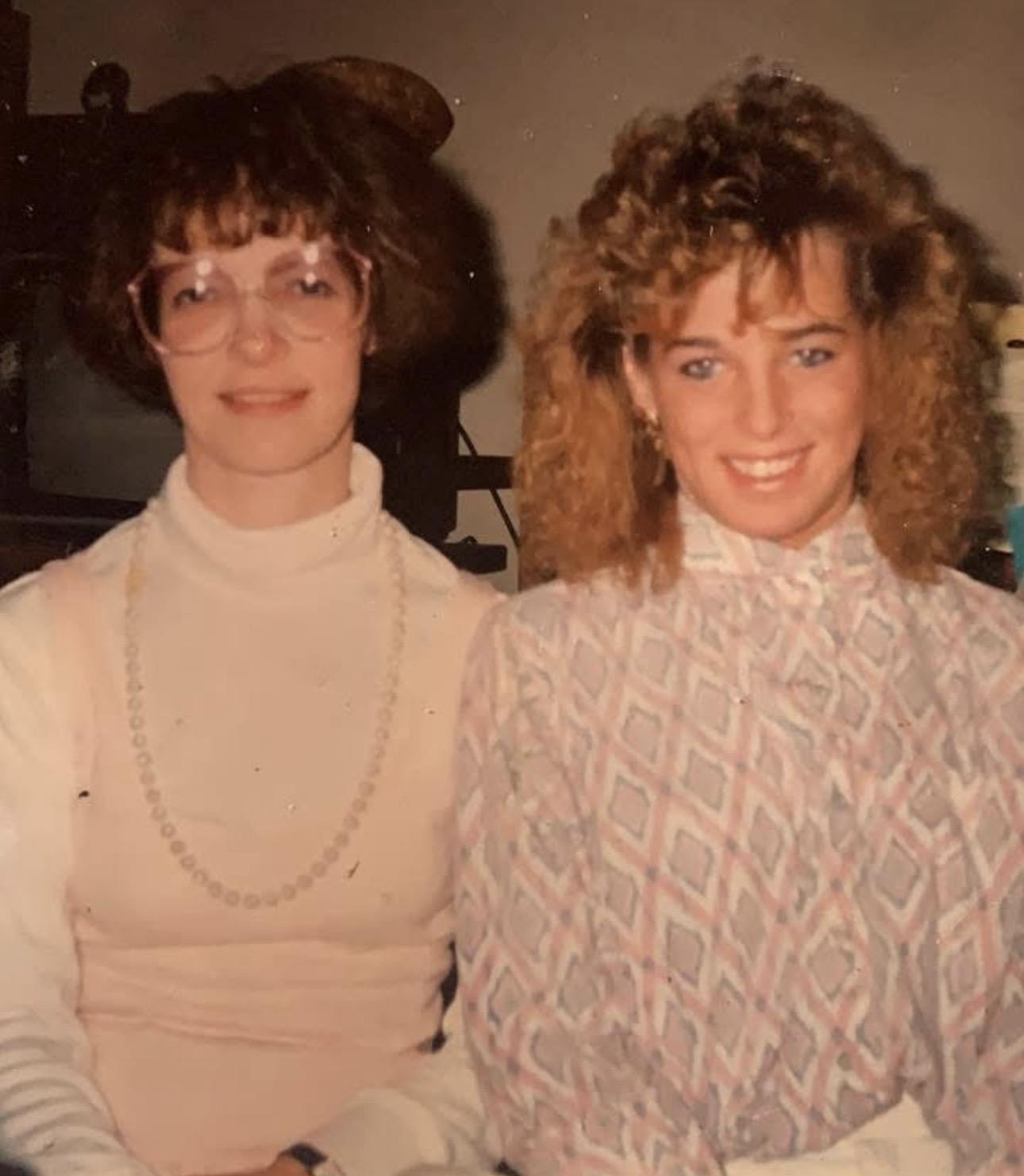 A couple of women posing for a picture