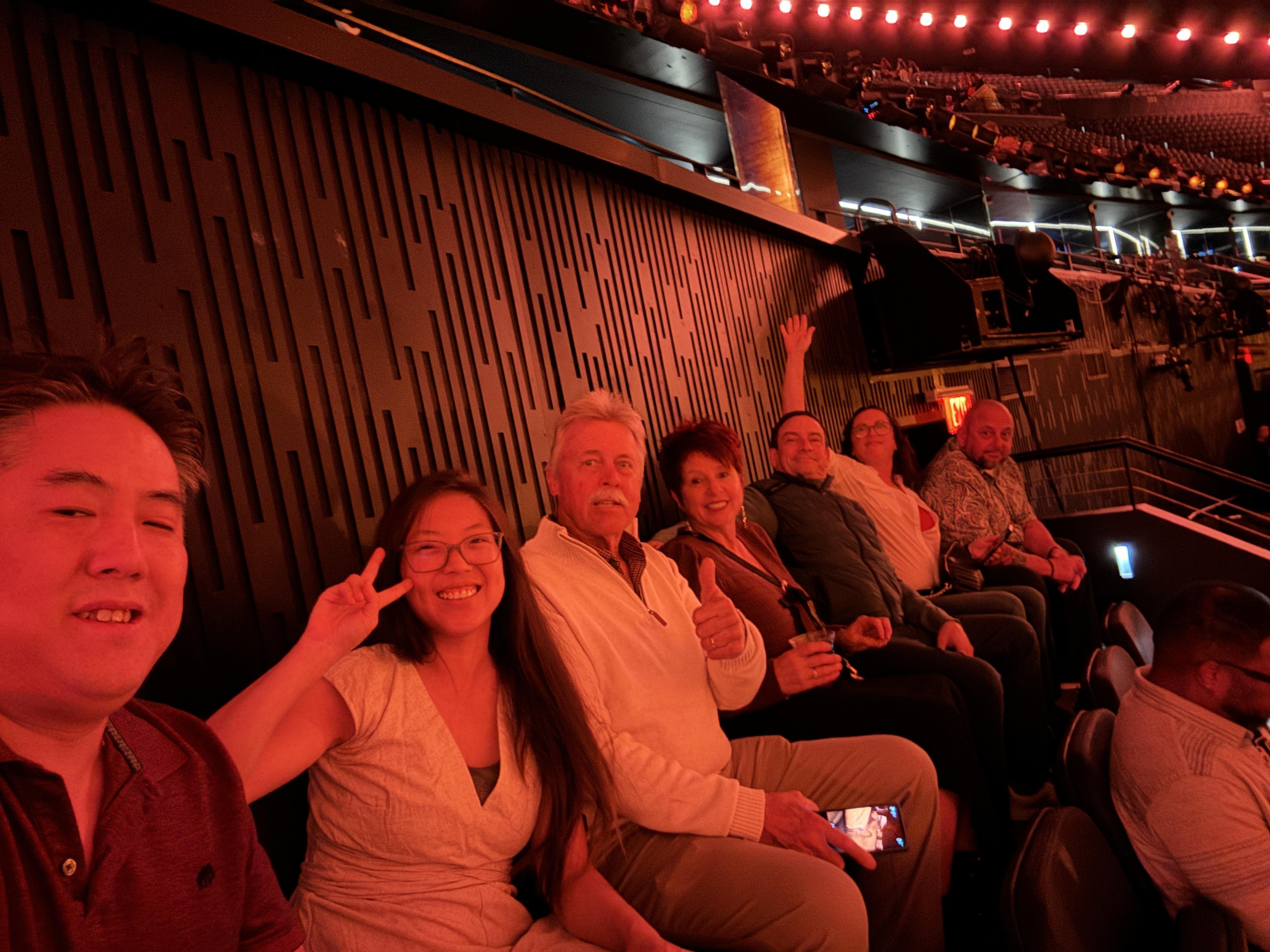 A group of people sitting in a theater