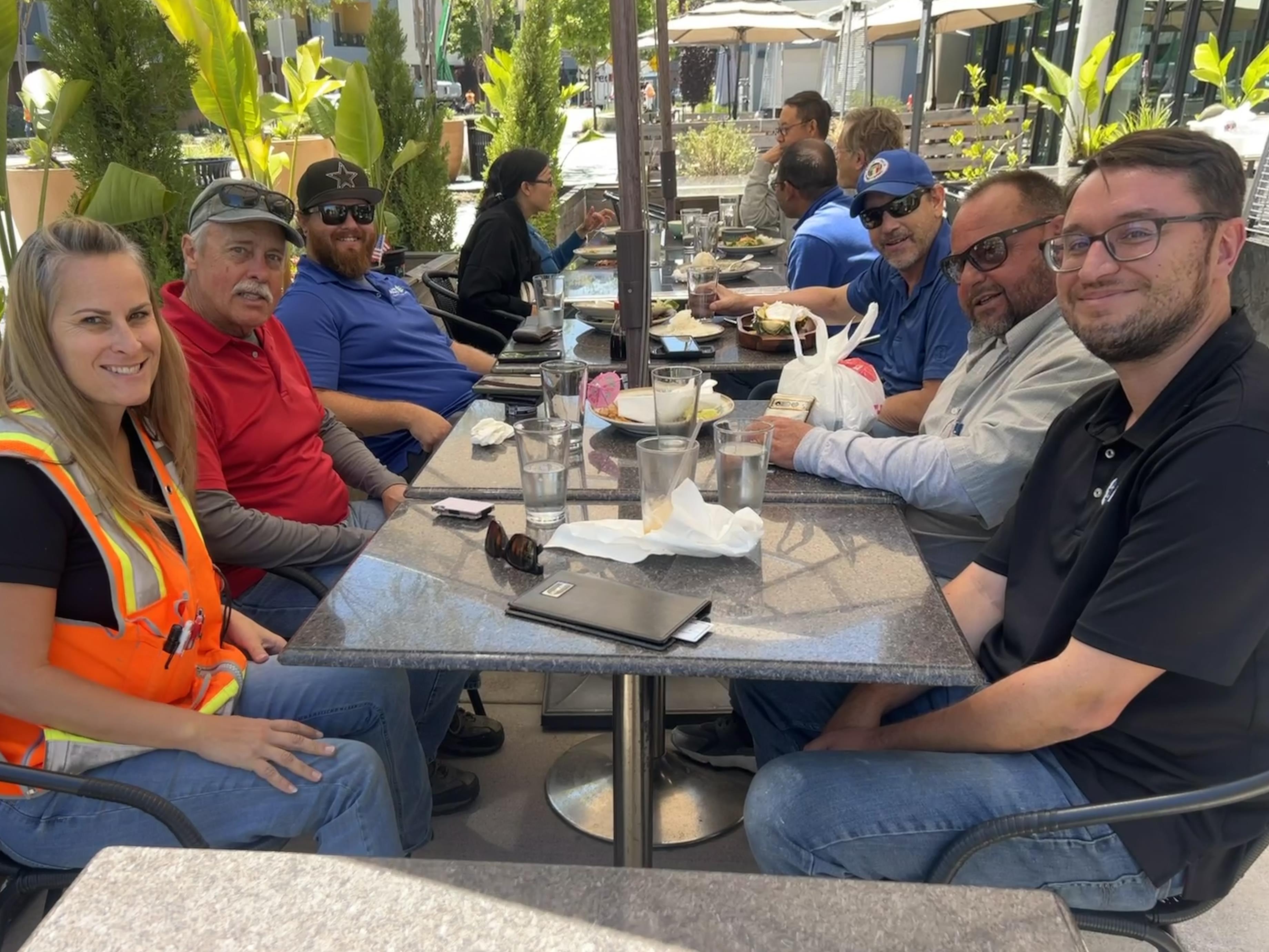 A group of people sitting at a table