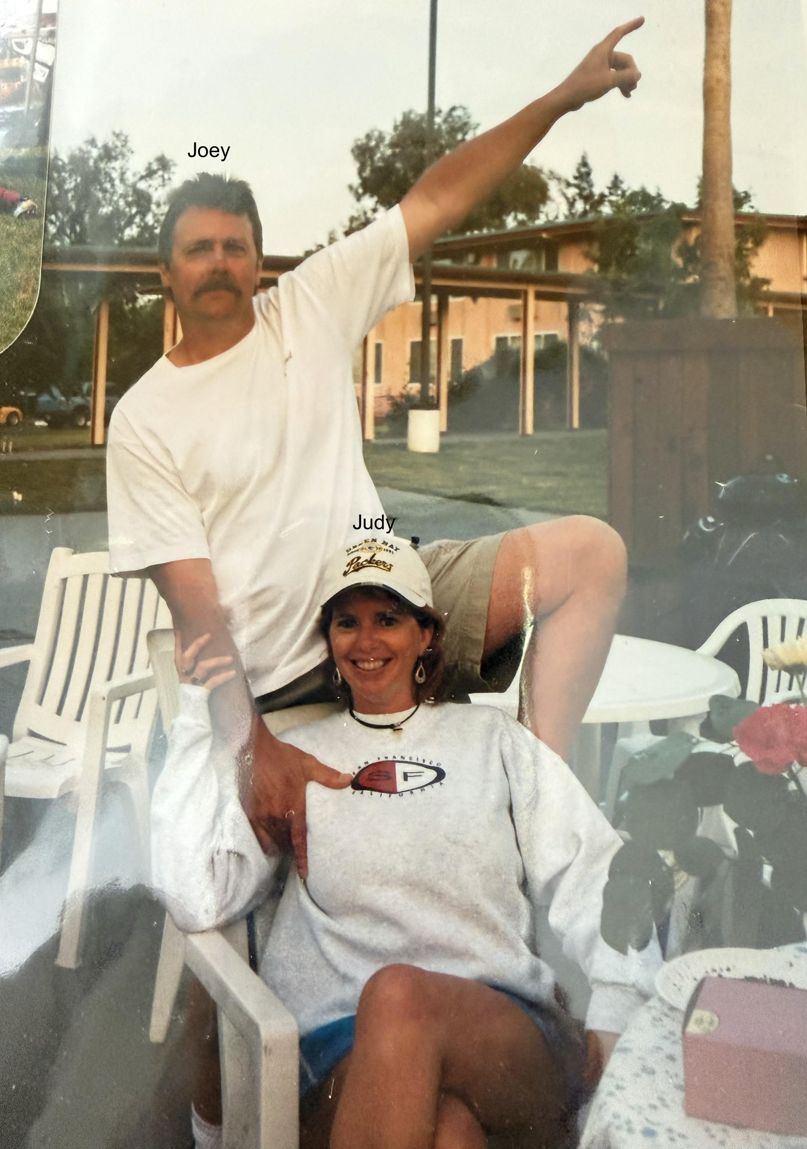 A man and woman posing for a picture