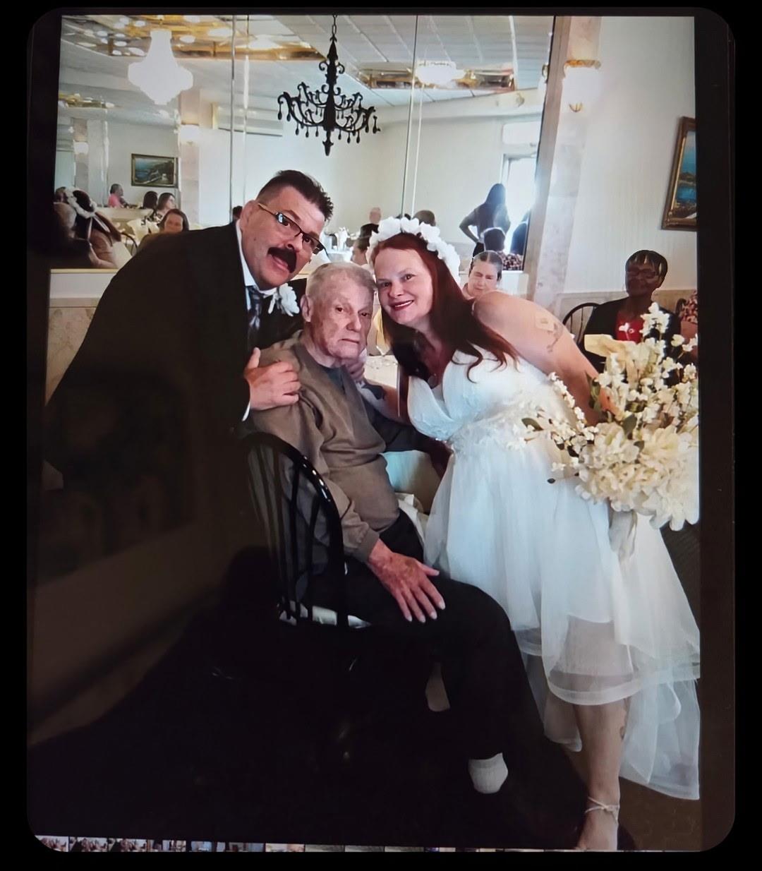 A man and woman posing for a picture