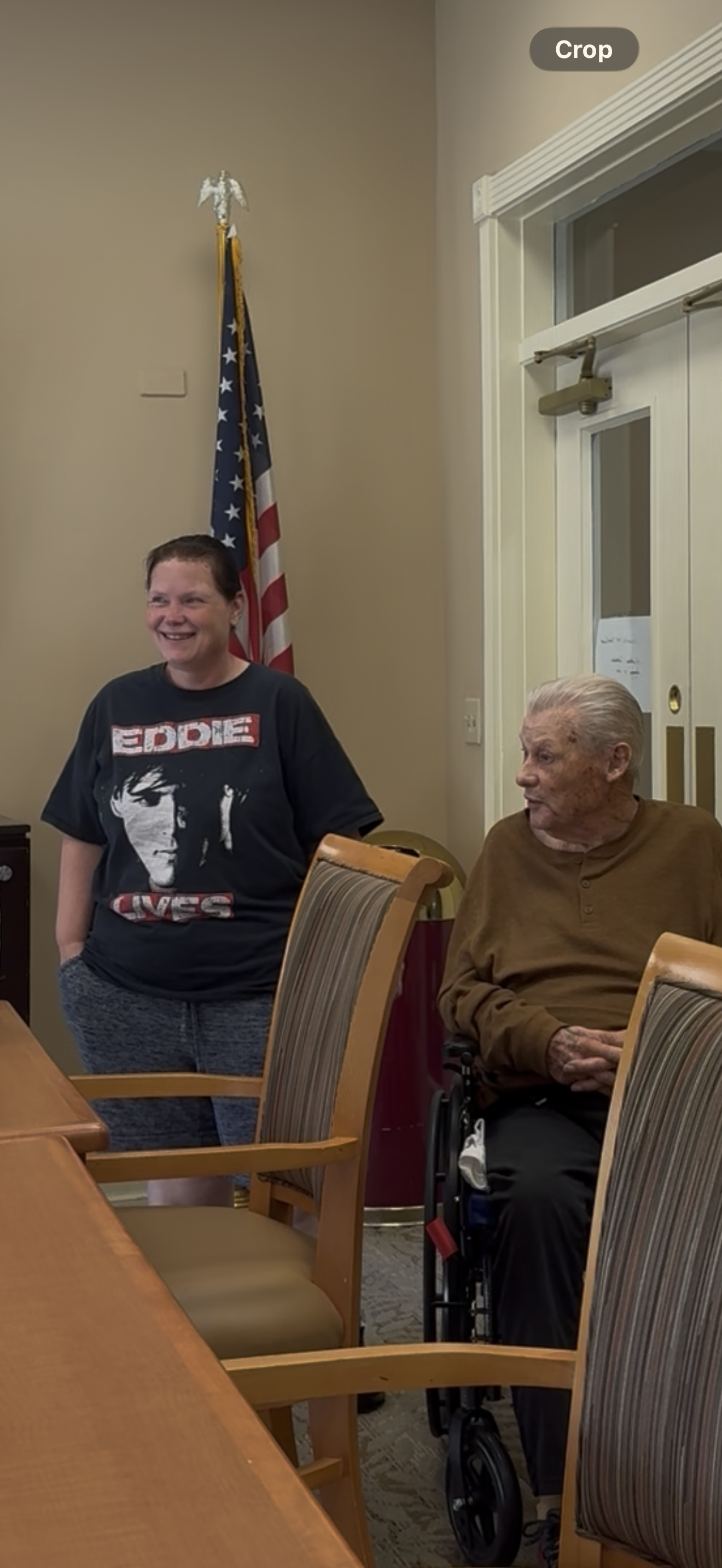 A woman standing next to an elderly woman