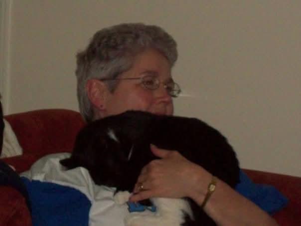 A woman holding a cat