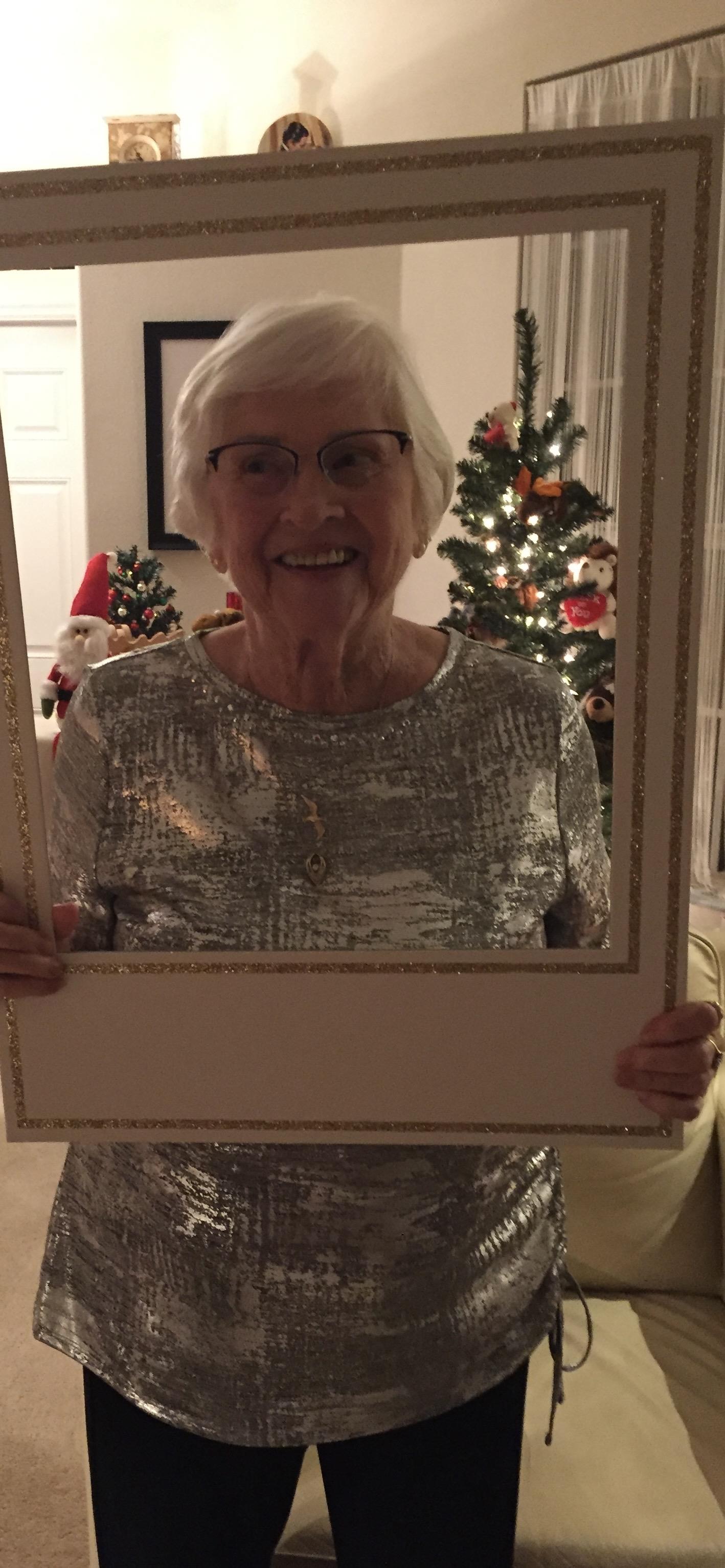 A woman holding a picture frame