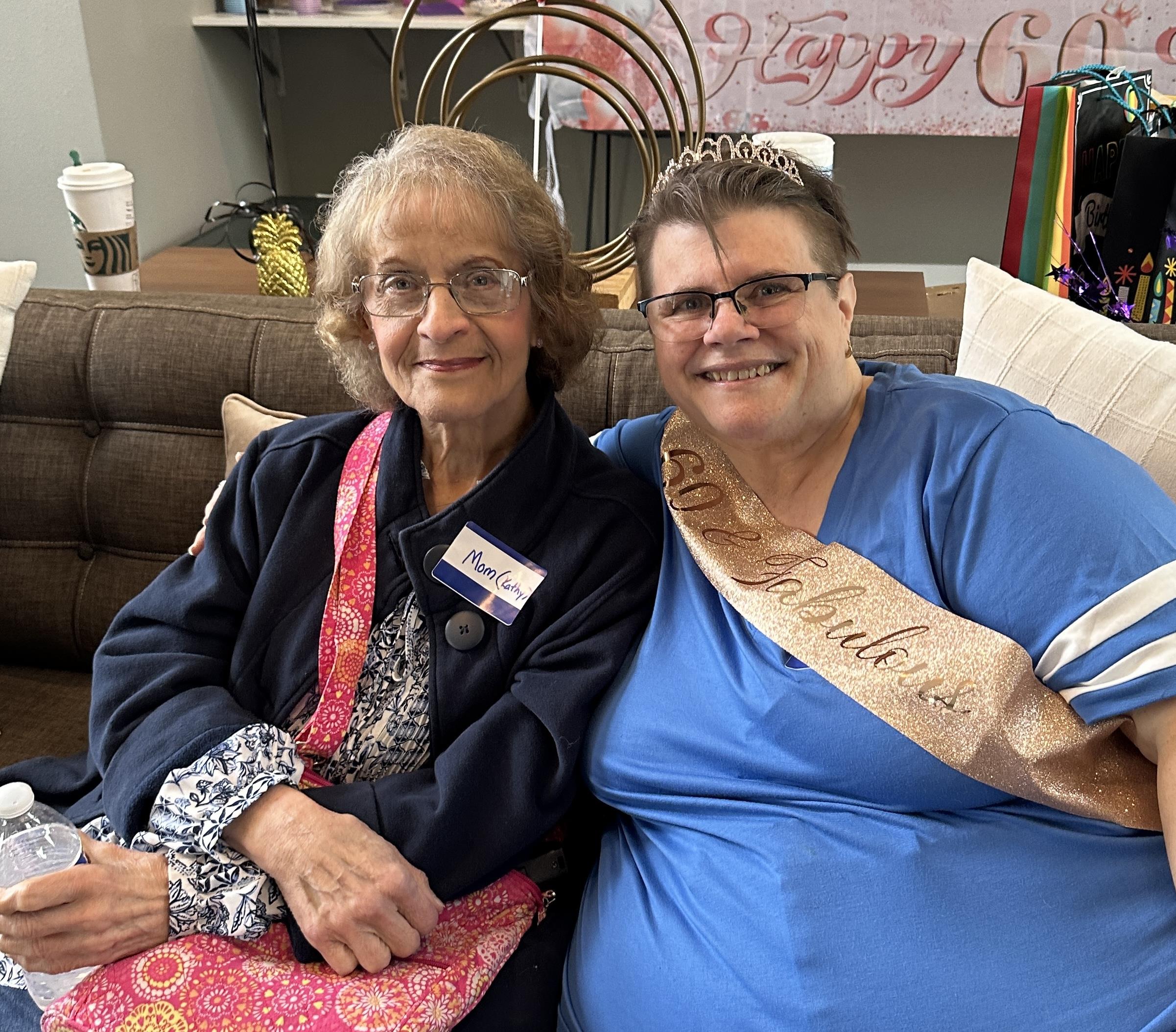 Two women sitting on a couch