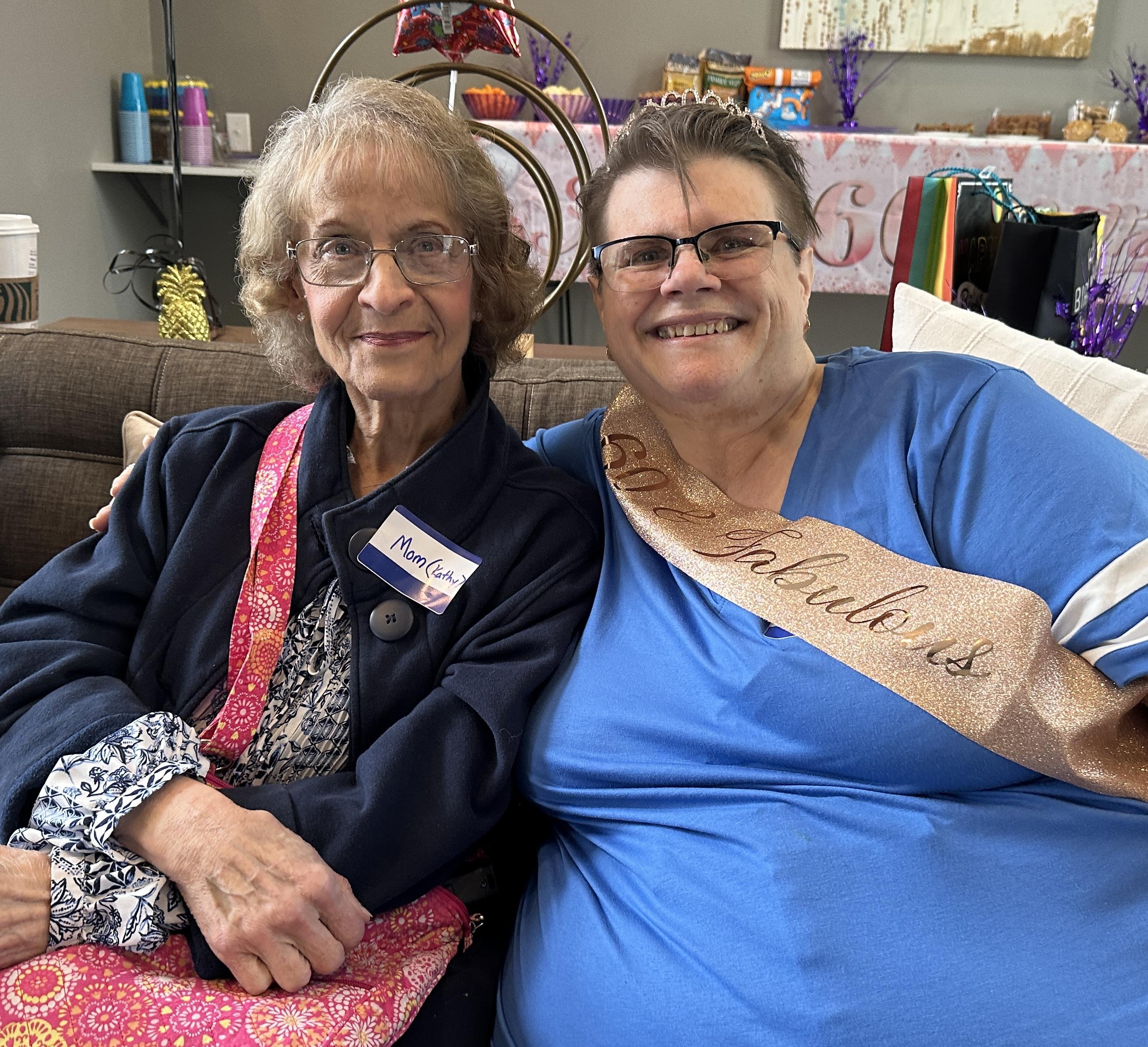Two women sitting on a couch