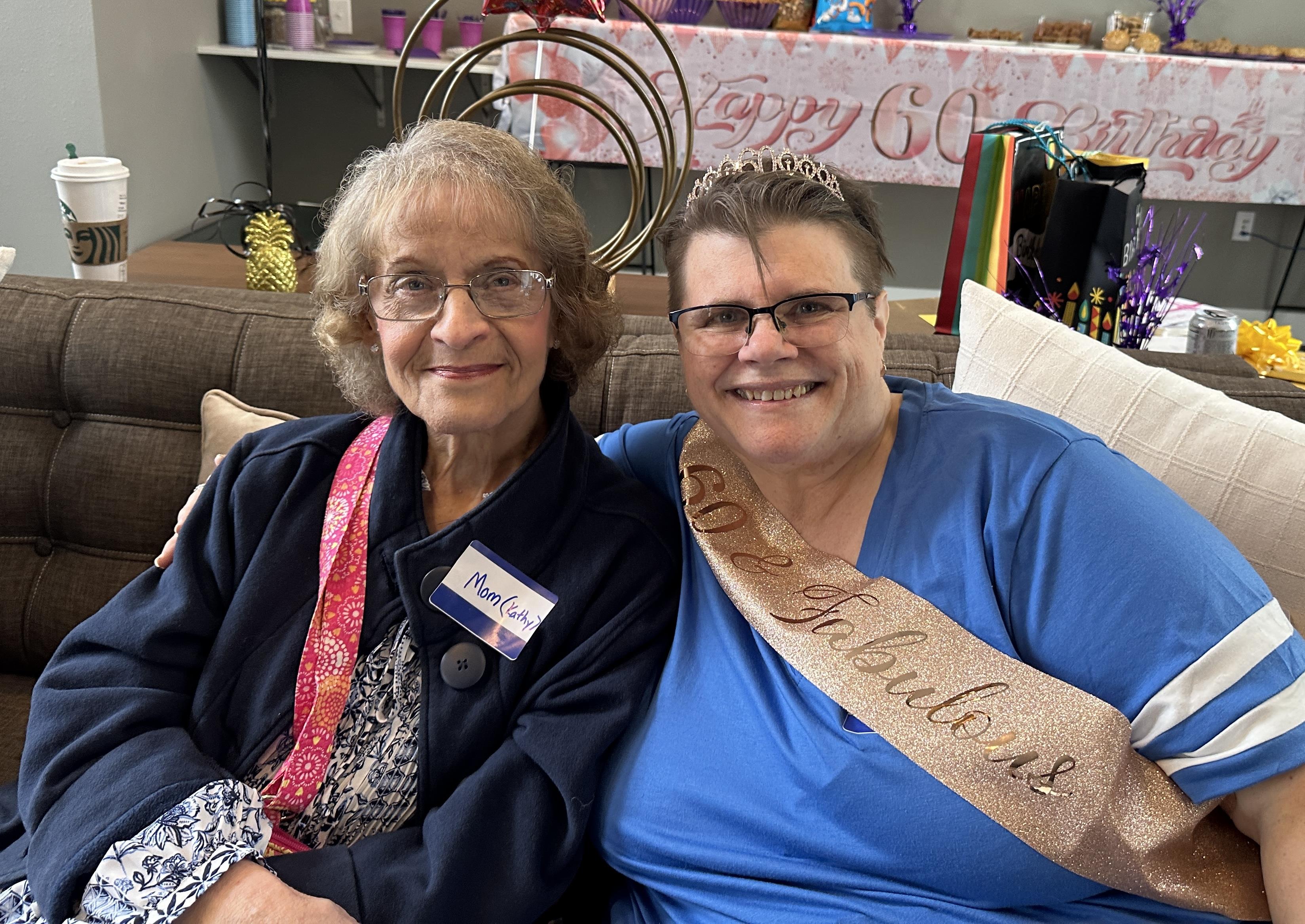 Two women sitting on a couch