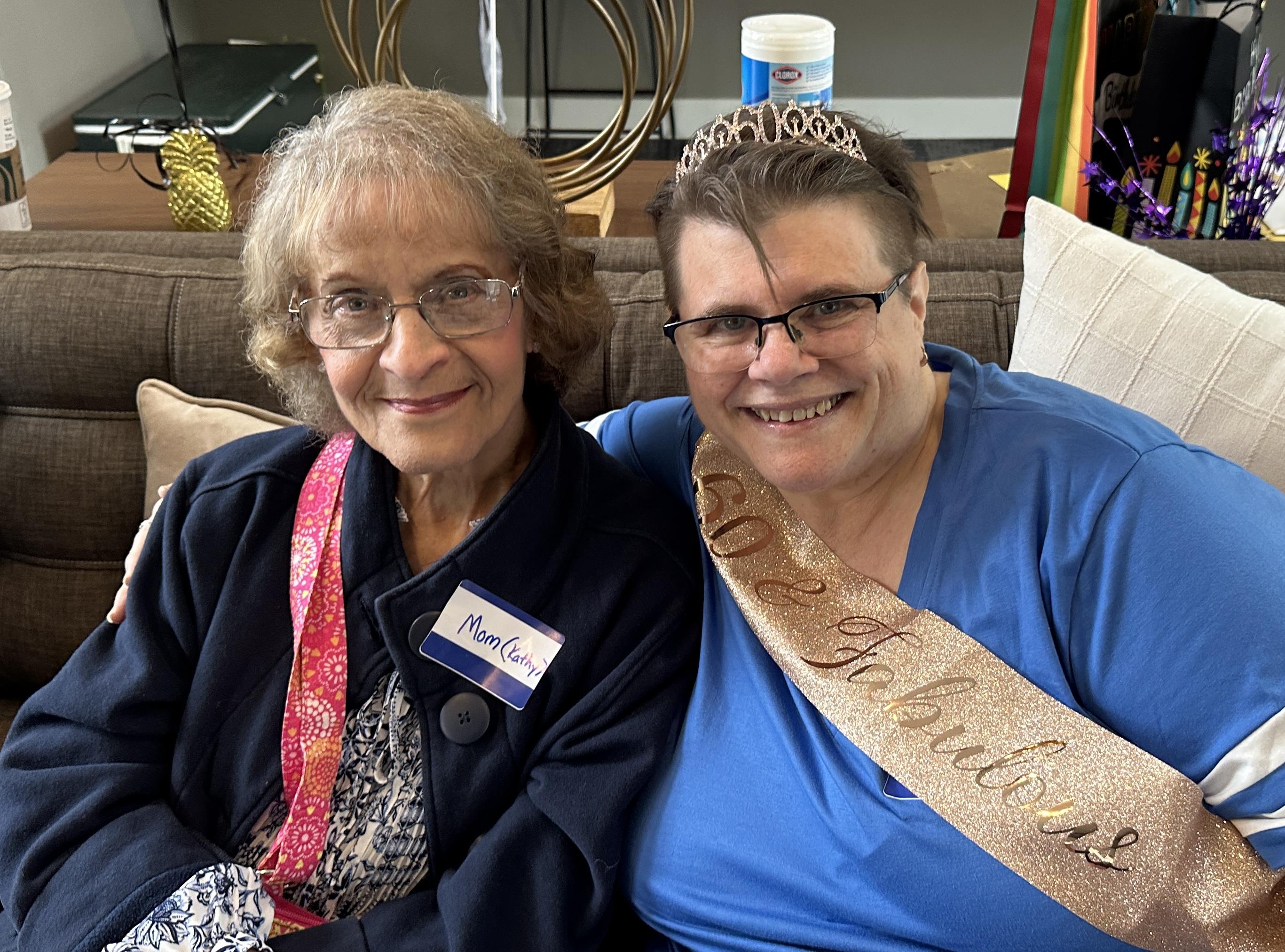 Two women sitting on a couch
