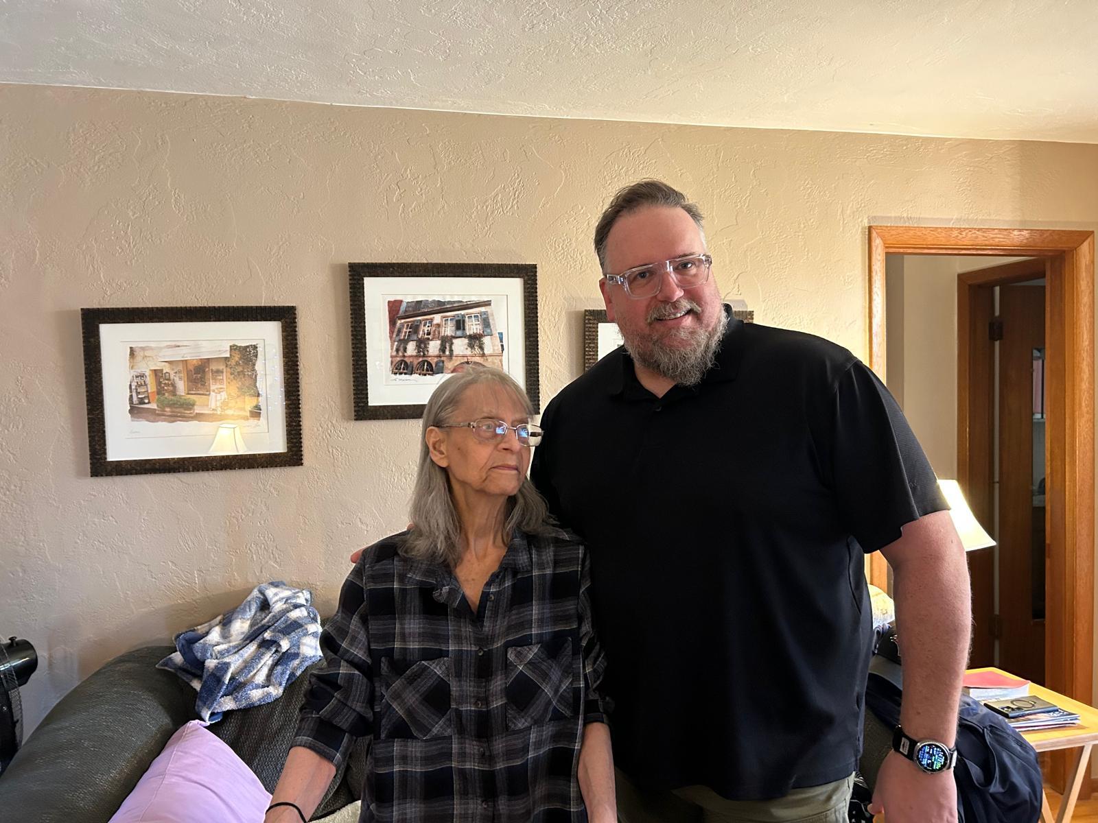 A man and woman standing in a room