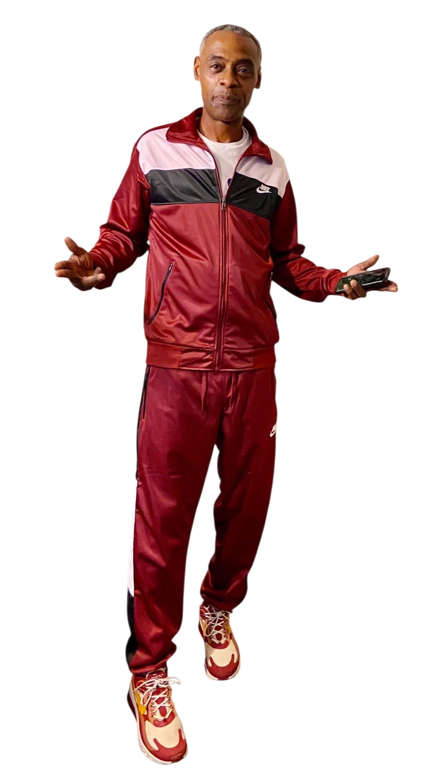 A man in a red tracksuit