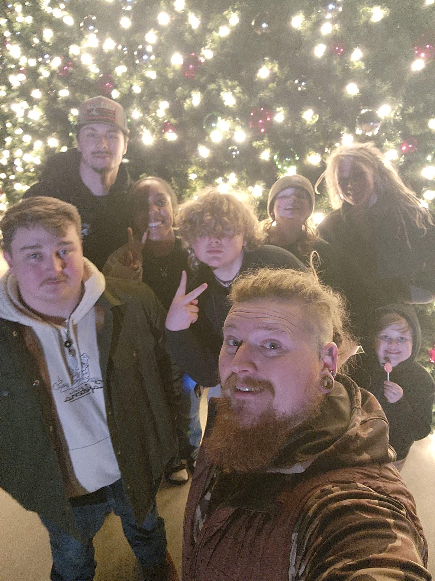A group of people taking a selfie