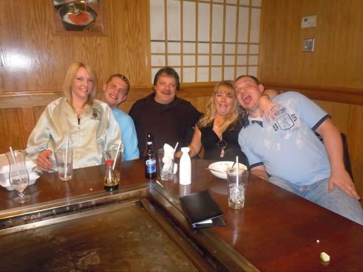 A group of people sitting at a table