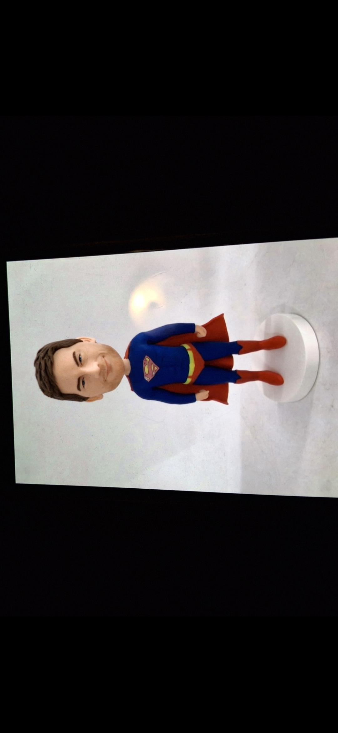 A figurine of a man in a superhero garment