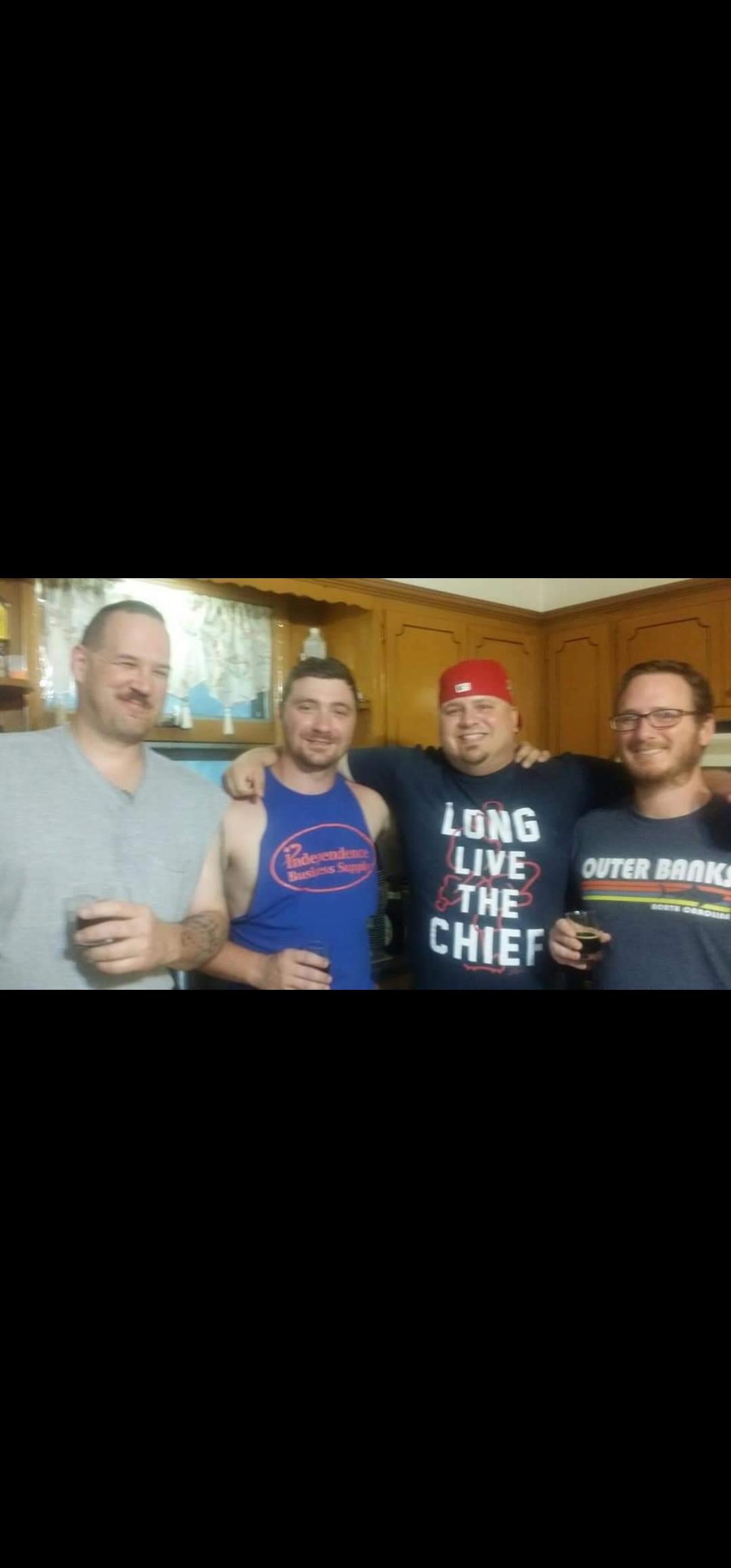 A group of men posing for a picture