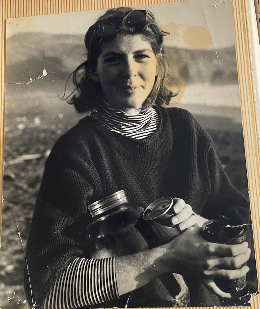 A woman holding cans