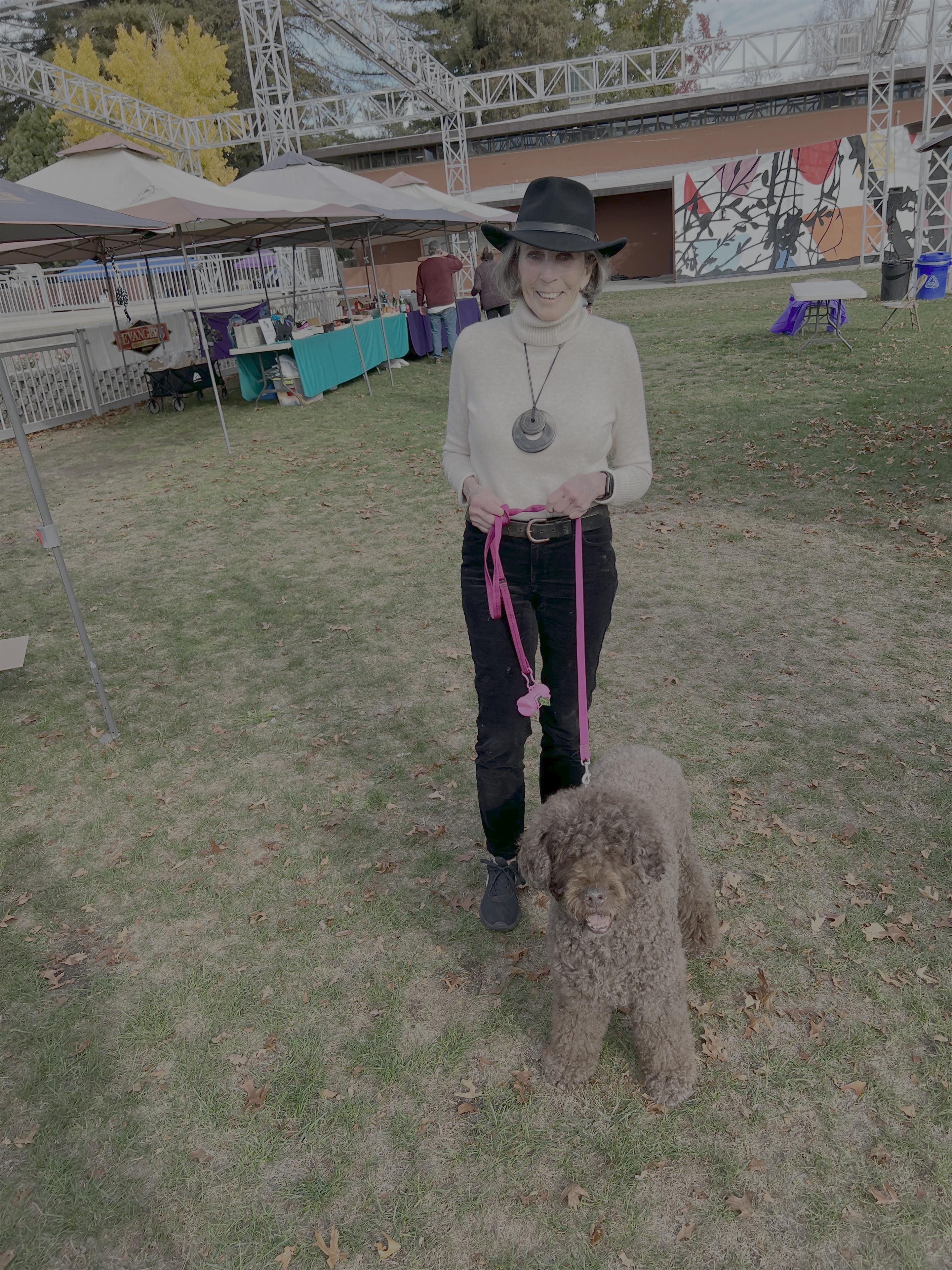 A woman walking a dog