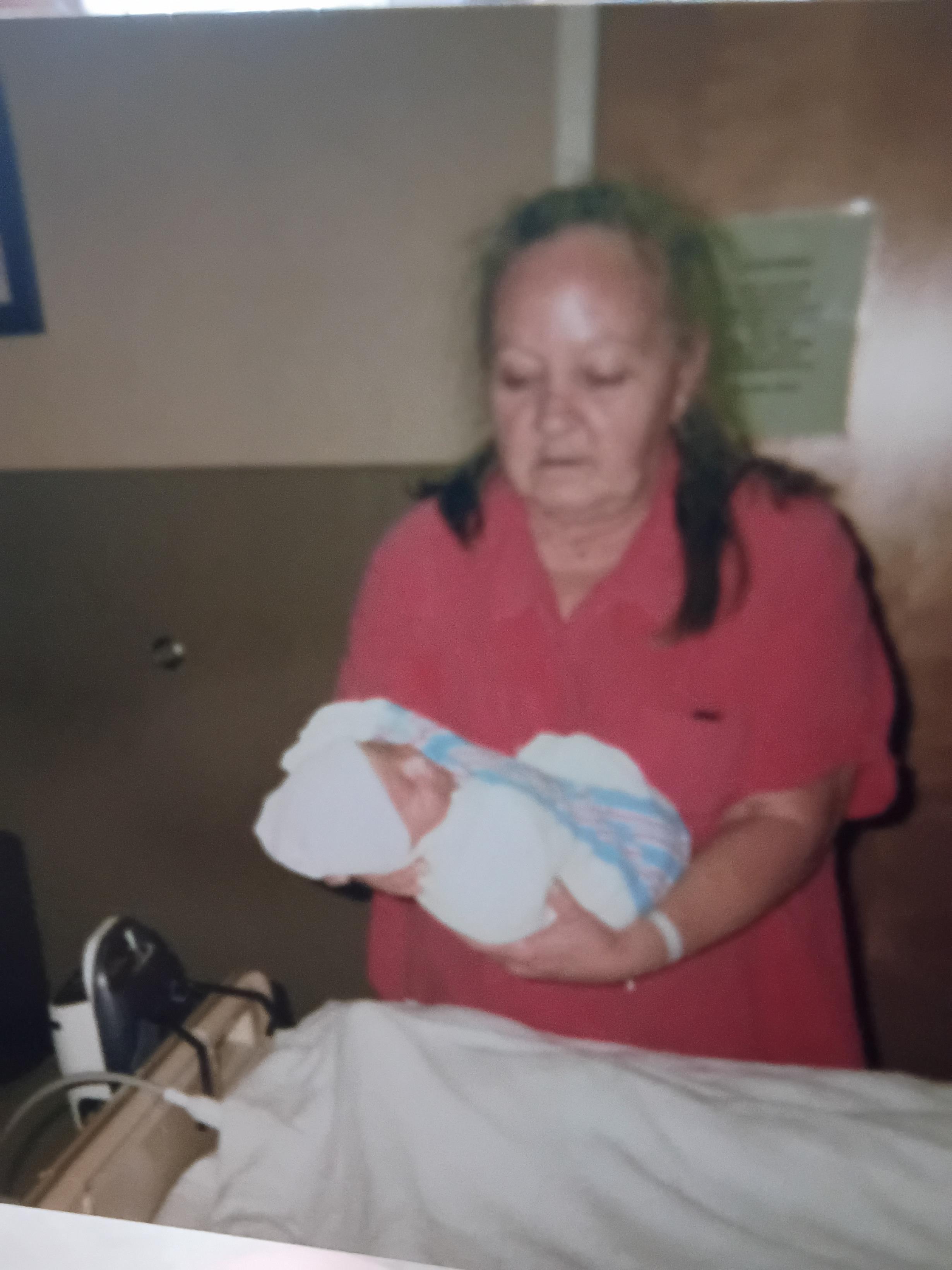 A woman holding a baby