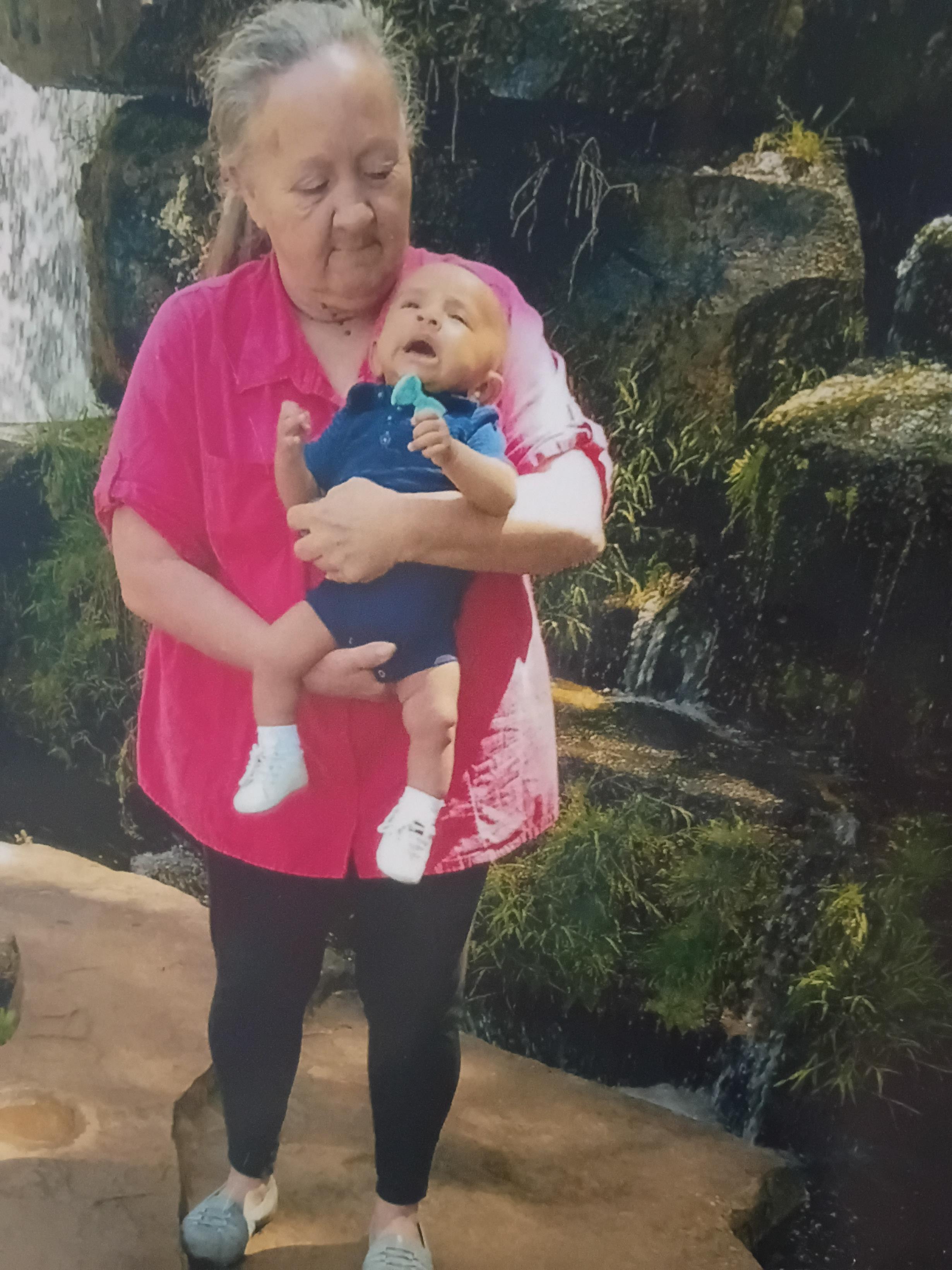 A woman holding a baby