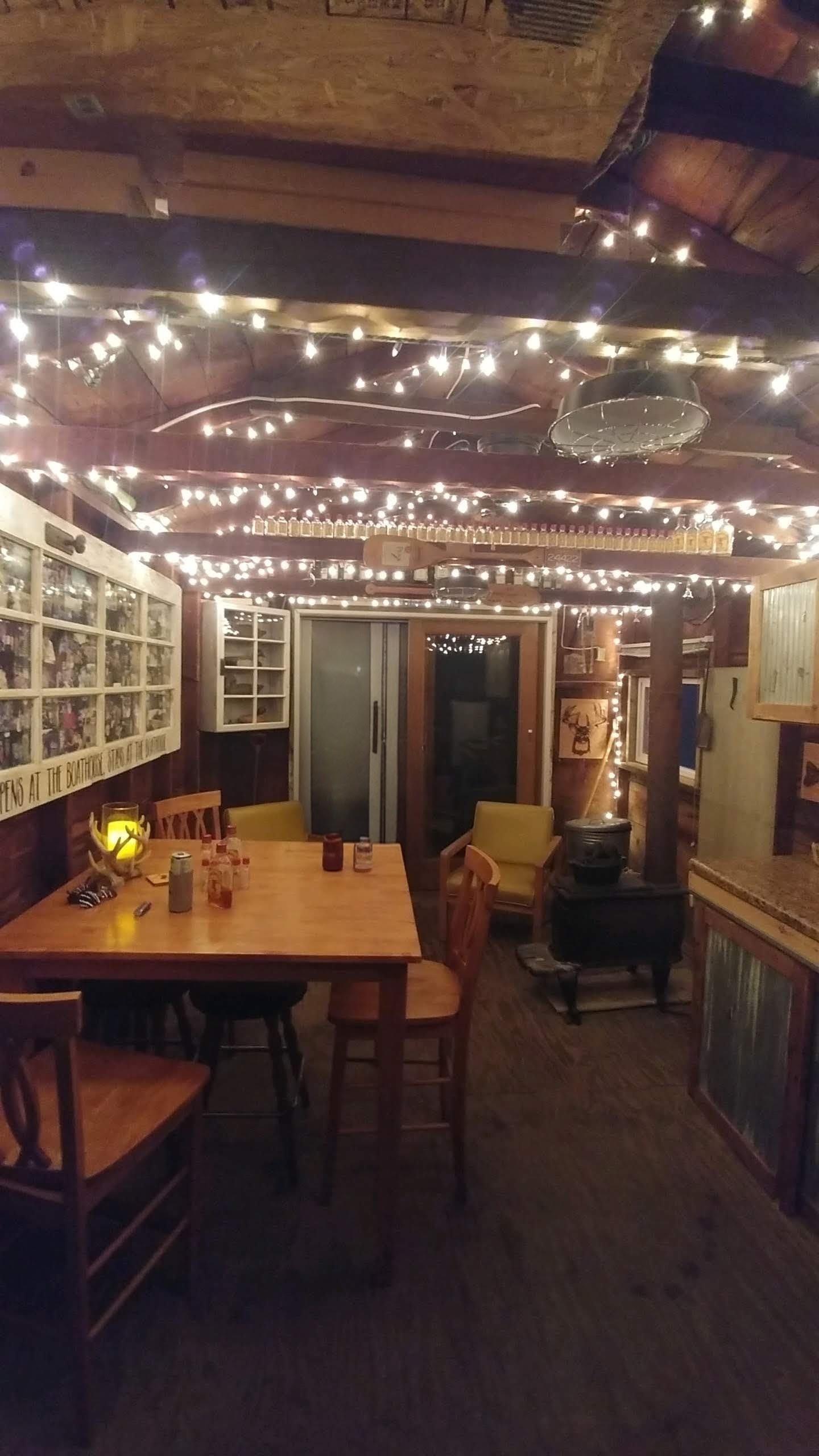 A room with a table and chairs and lights
