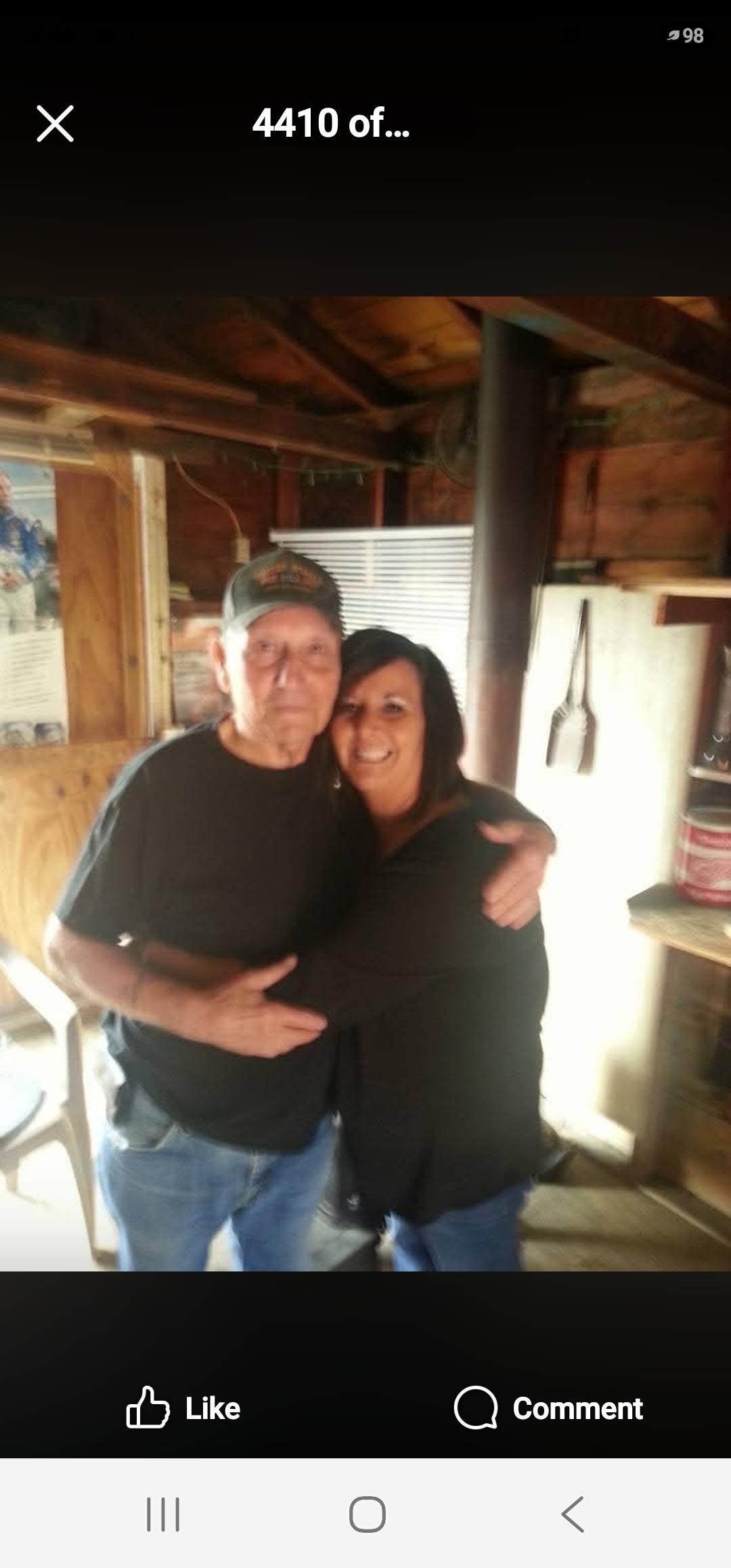 A man and woman hugging in a cabin